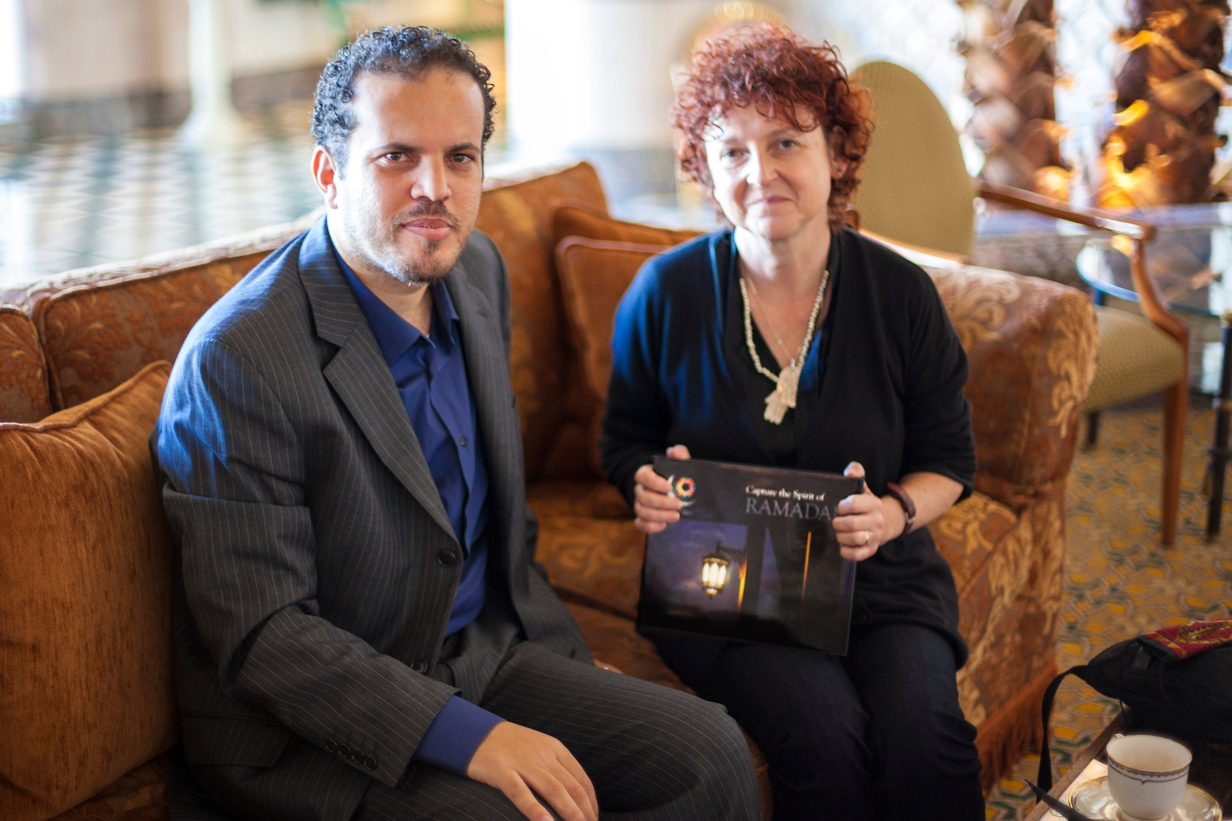 Basel Almisshal presenting the book to Dr Venetia Porter of the British Museum