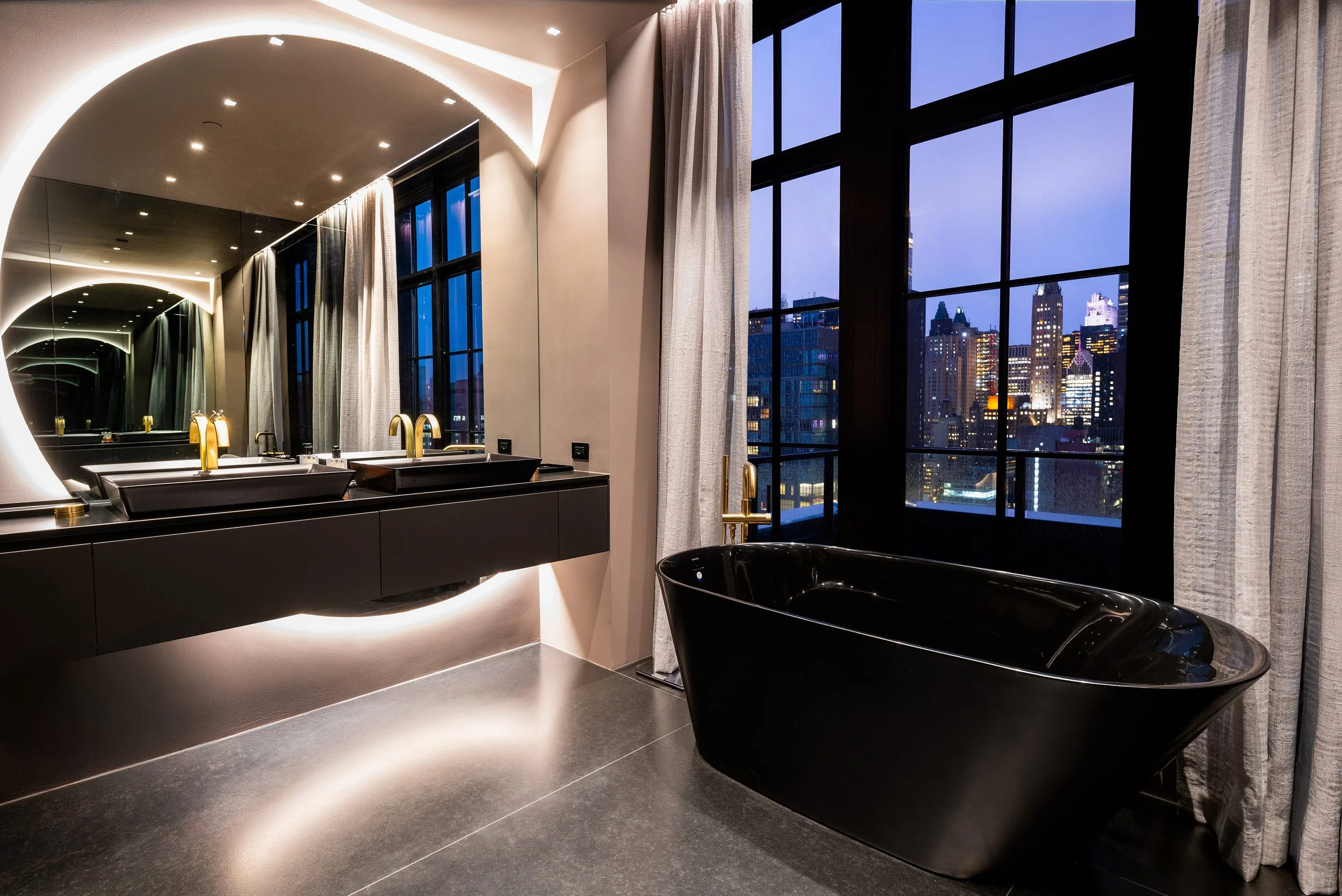 Primary bath - sculptural black tub - photography by Studio Basel Media
