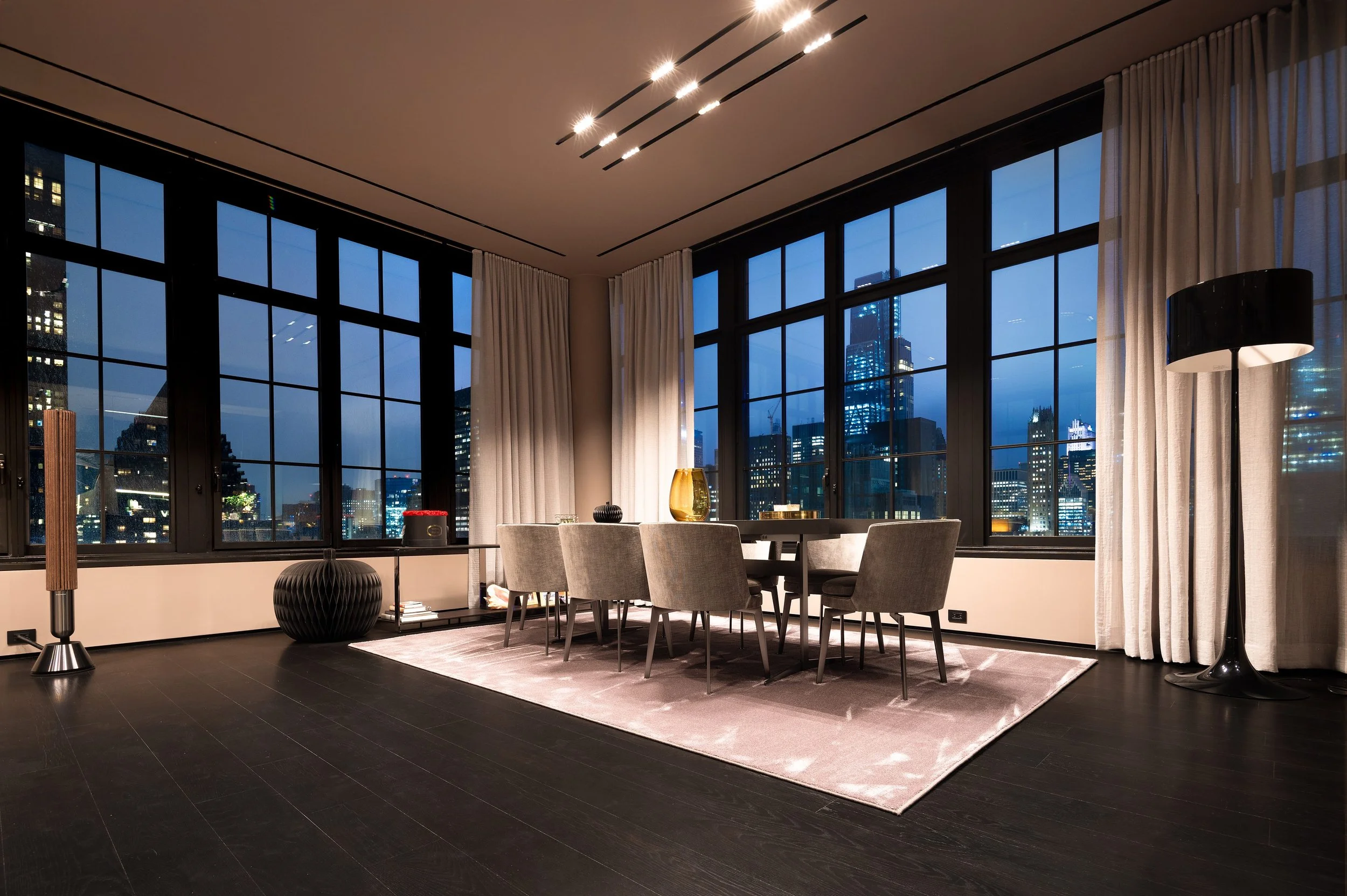 Living & dining at dusk - Midtown views - photography by Studio Basel Media