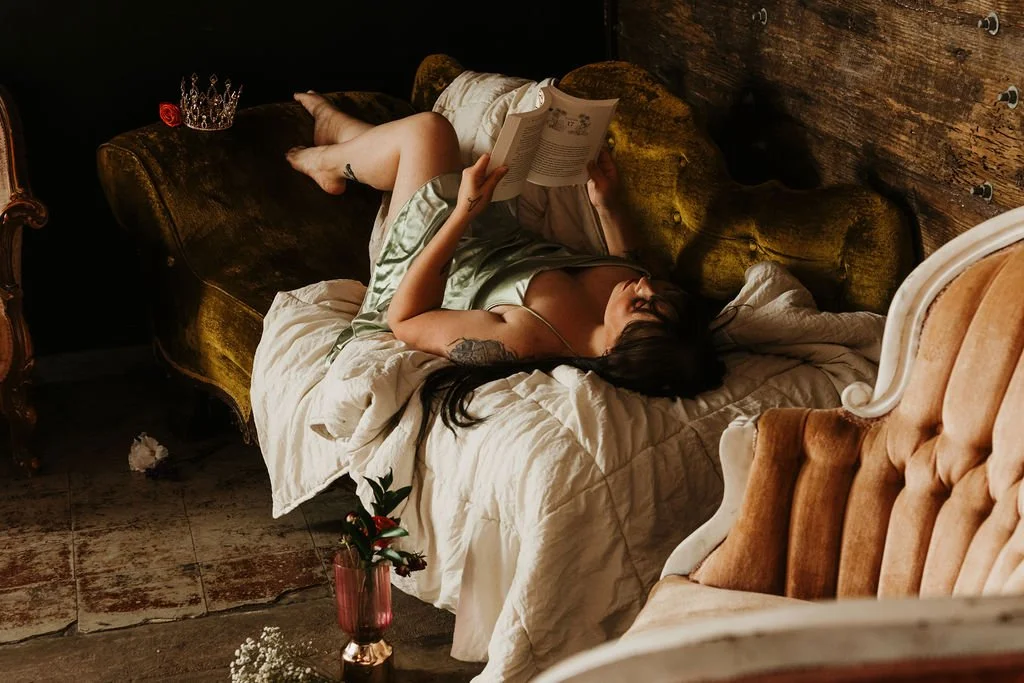 Demure boudoir portrait in cozy sweater and thigh highs