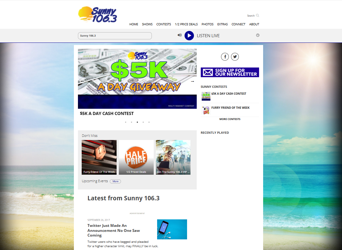 Sunny 106.3 homepage with beach imagery, a $5K a Day giveaway feature, newsletter signup and listener promotions.