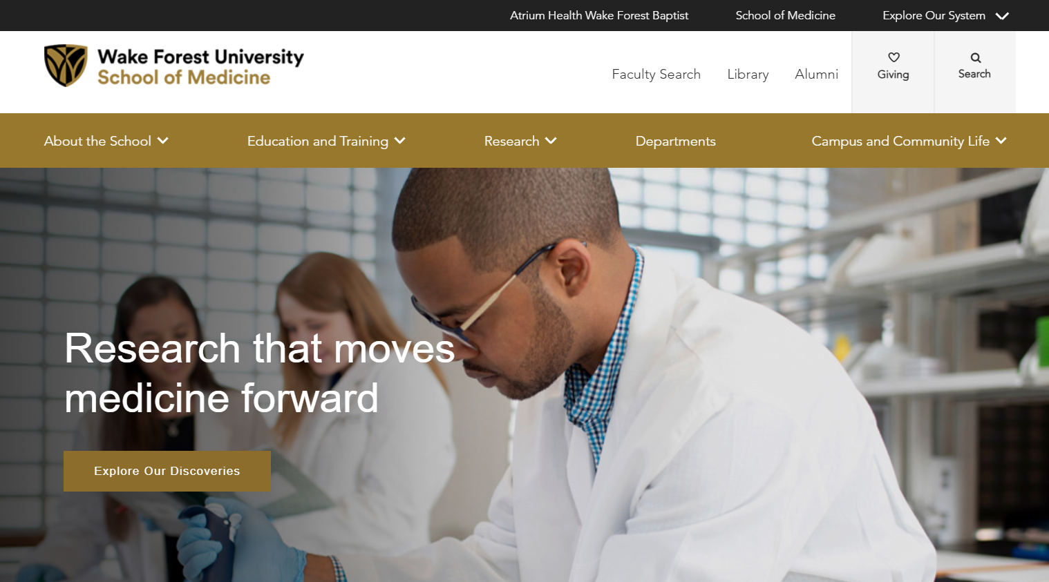 Wake Forest University School of Medicine homepage featuring a laboratory research image and navigation for education, research and campus life.