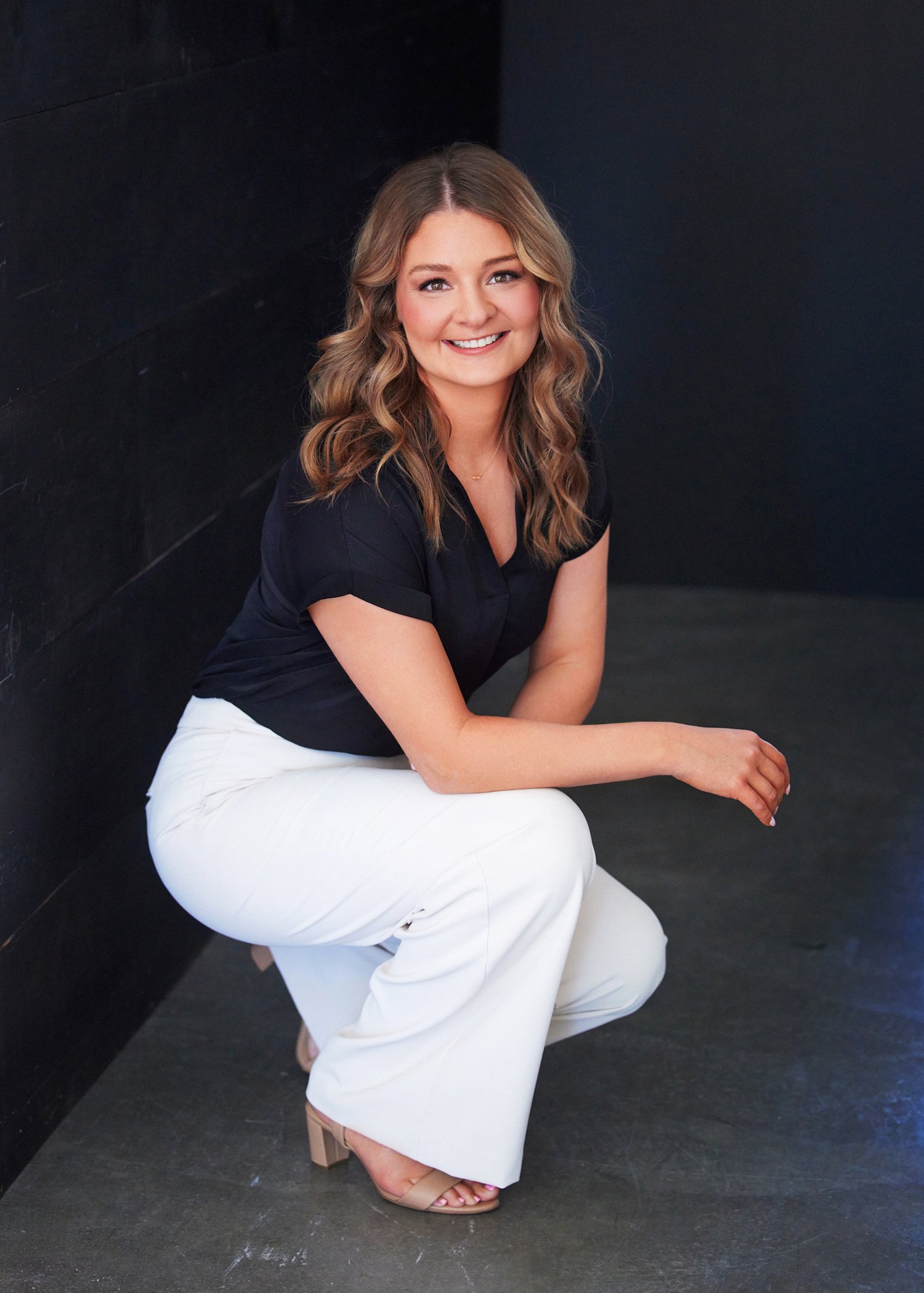 Casual and elegant photo of Hunter Hamblin seated with relaxed posture and bright ambiance