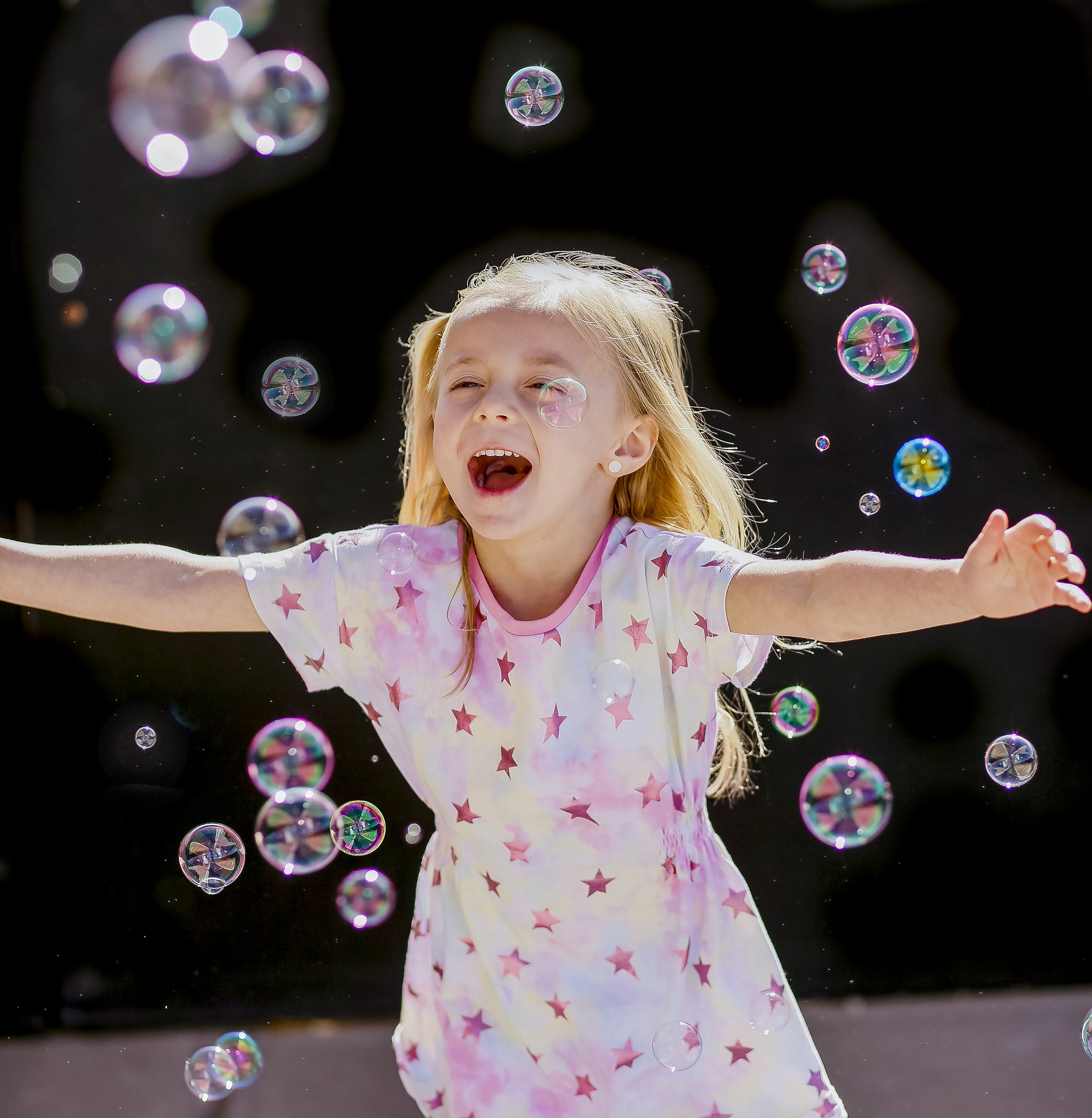 happy girl with bubbles
