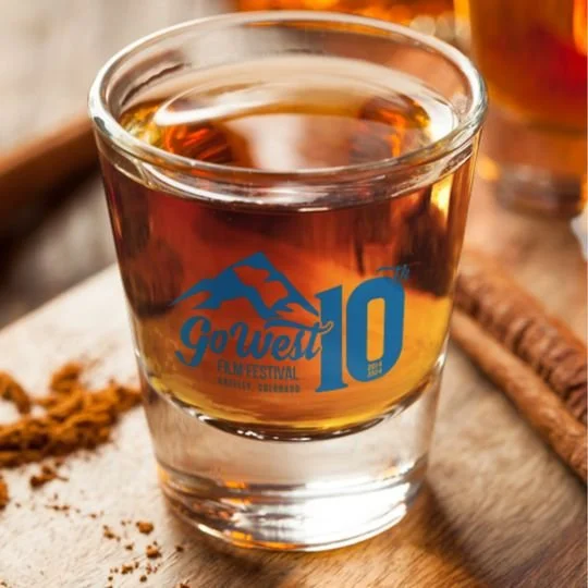 Go West Film Festival 10th anniversary shot glass with a blue logo marking 2014 to 2024