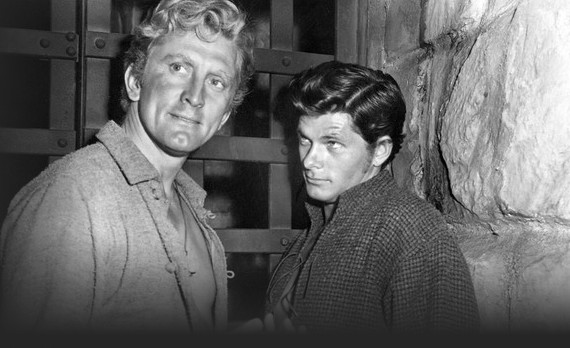 Kirk Douglas as Jim Deakins and Dewey Martin as Boone Caudill confined to a St. Louis jail cell in the 1952 western The Big Sky