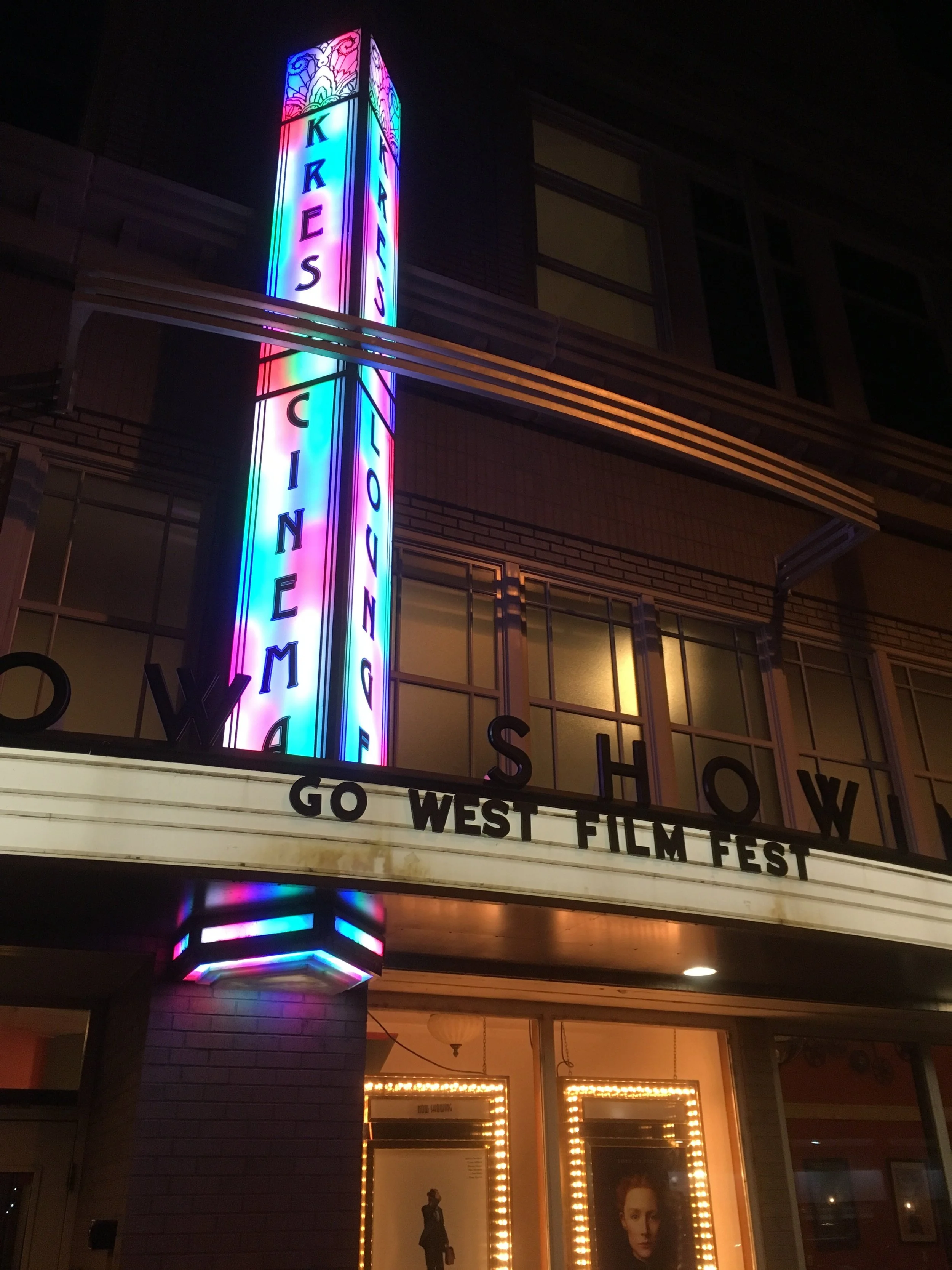 The Kress Cinema and Lounge marquee in downtown Greeley lit up at night with Go West Film Fest on the board