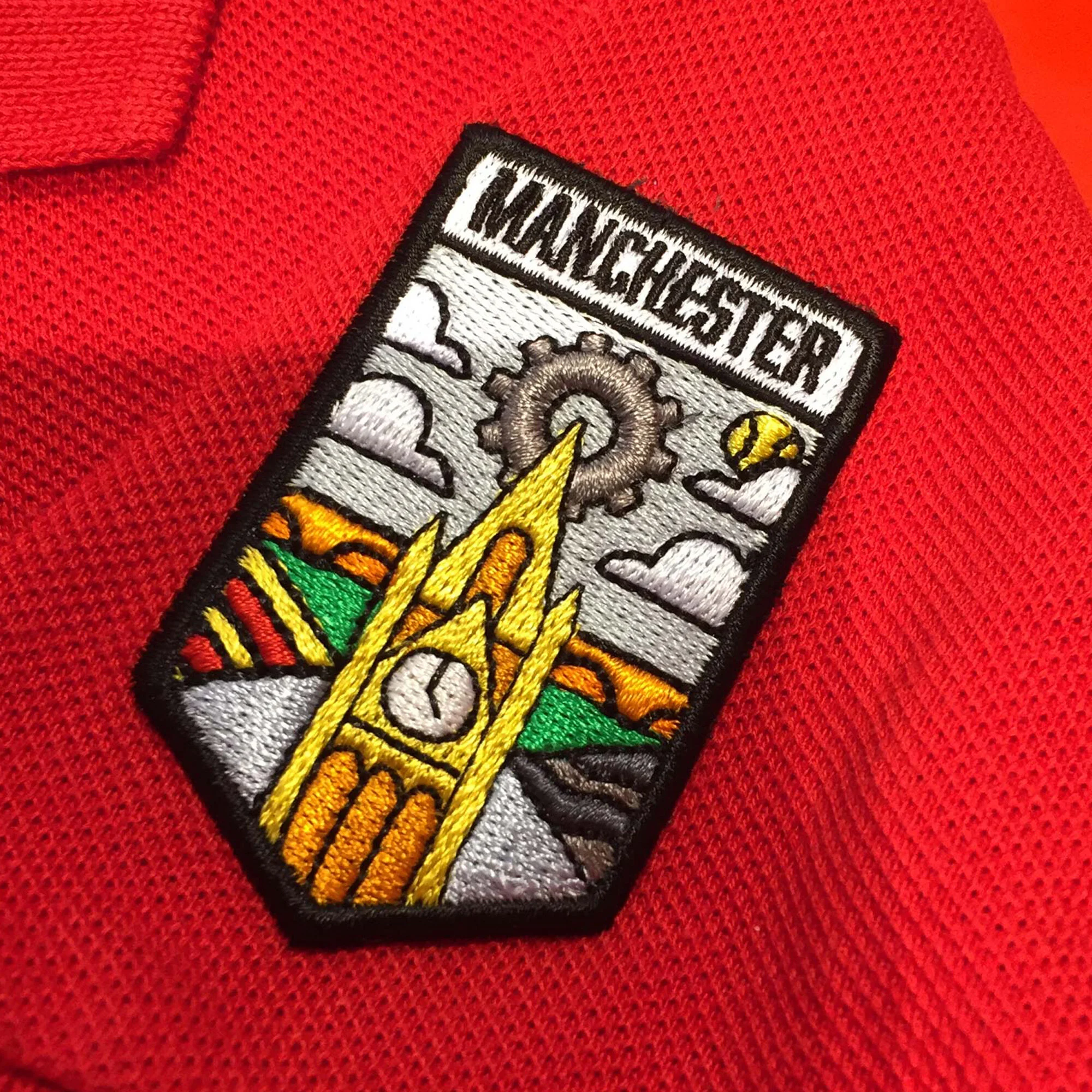 Close-up of limited edition embroidered Lacoste City Badge Manchester Edition