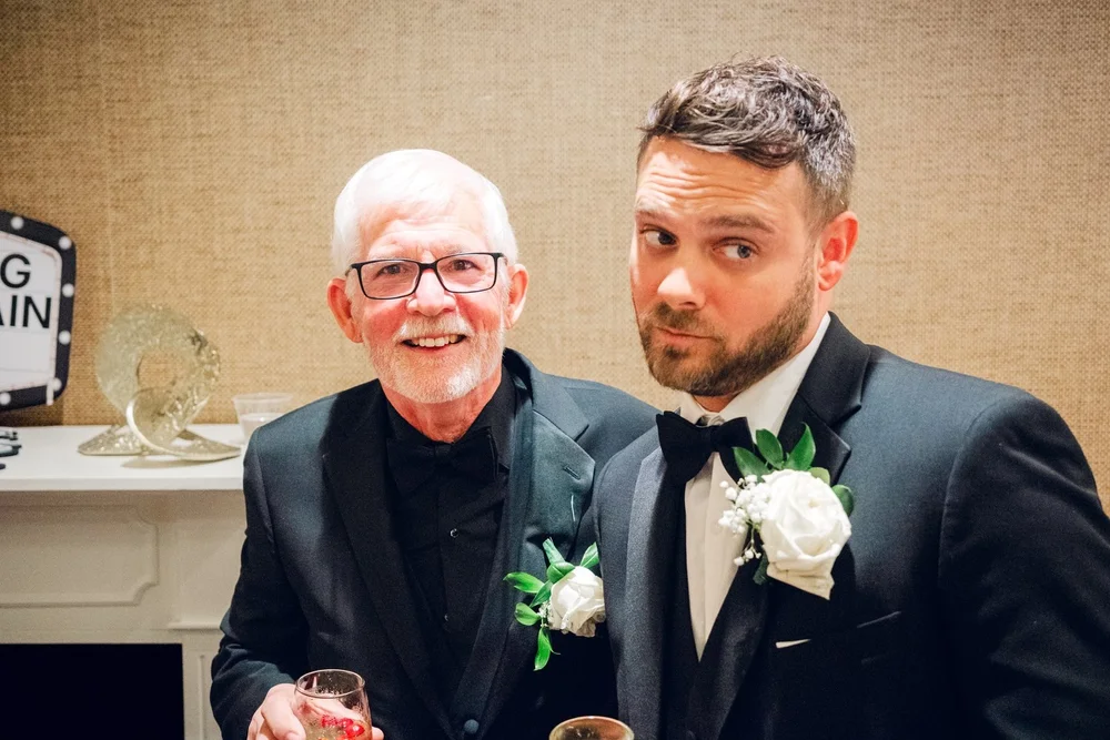 Beauport Hotel wedding videographer, Gloucester, MA — groom sharing a candid moment with a guest during cocktail hour