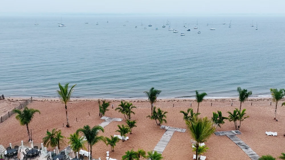 Anthony's Ocean View wedding videographer, New Haven, CT — aerial view of the private sandy beach, palm trees, and Long Island Sound