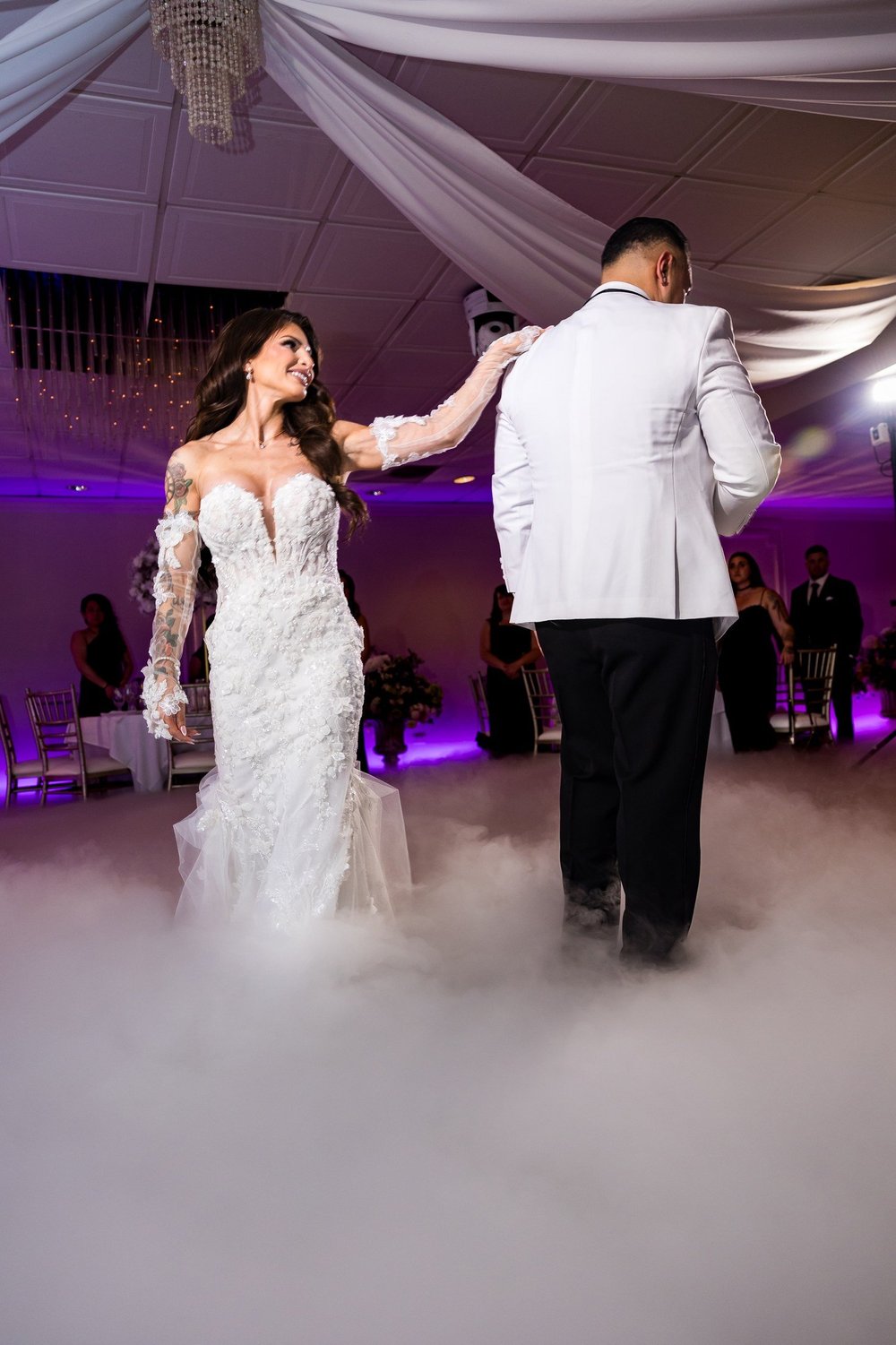 Anthony's Ocean View wedding videographer, New Haven, CT — couple dancing on dry-ice clouds during their ballroom reception