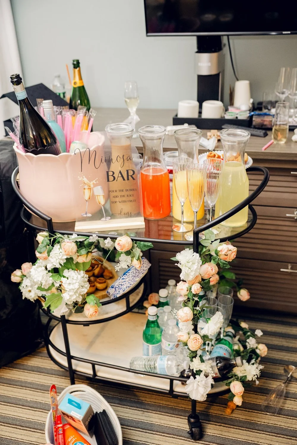 Beauport Hotel wedding photographer, Gloucester, MA — champagne and pastel cocktail bar cart with fresh florals on the wedding morning