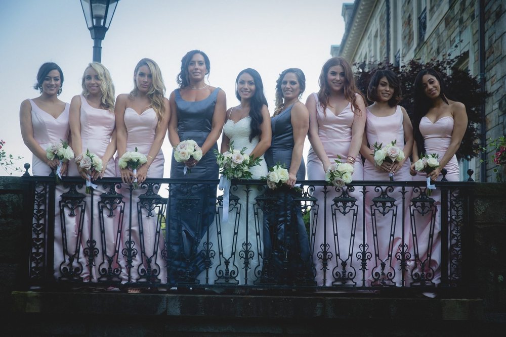 Aldrich Mansion wedding photographer, Warwick, RI — bridal party portrait overlooking the stone facade of Aldrich Mansion