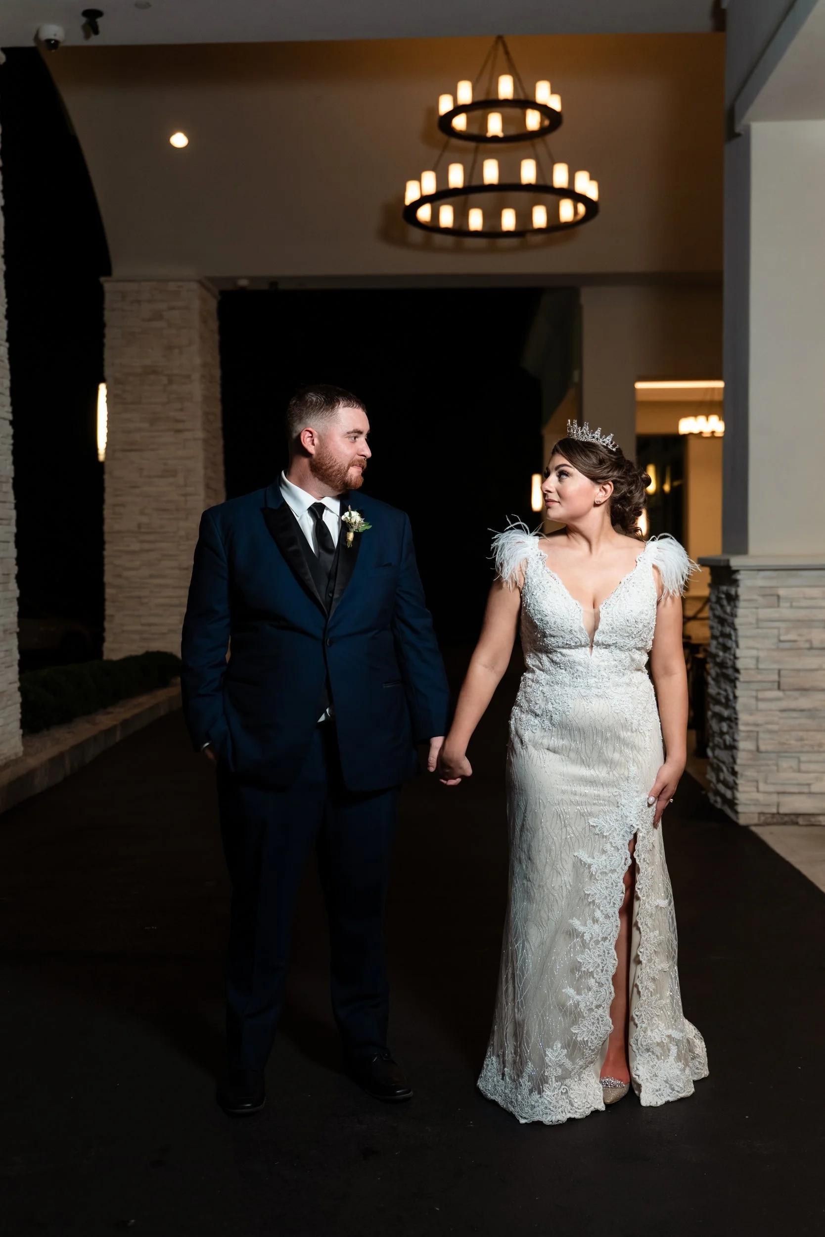 Couple in a chandelier-lit entrance at Lakeview Pavilion, Foxborough, Massachusetts