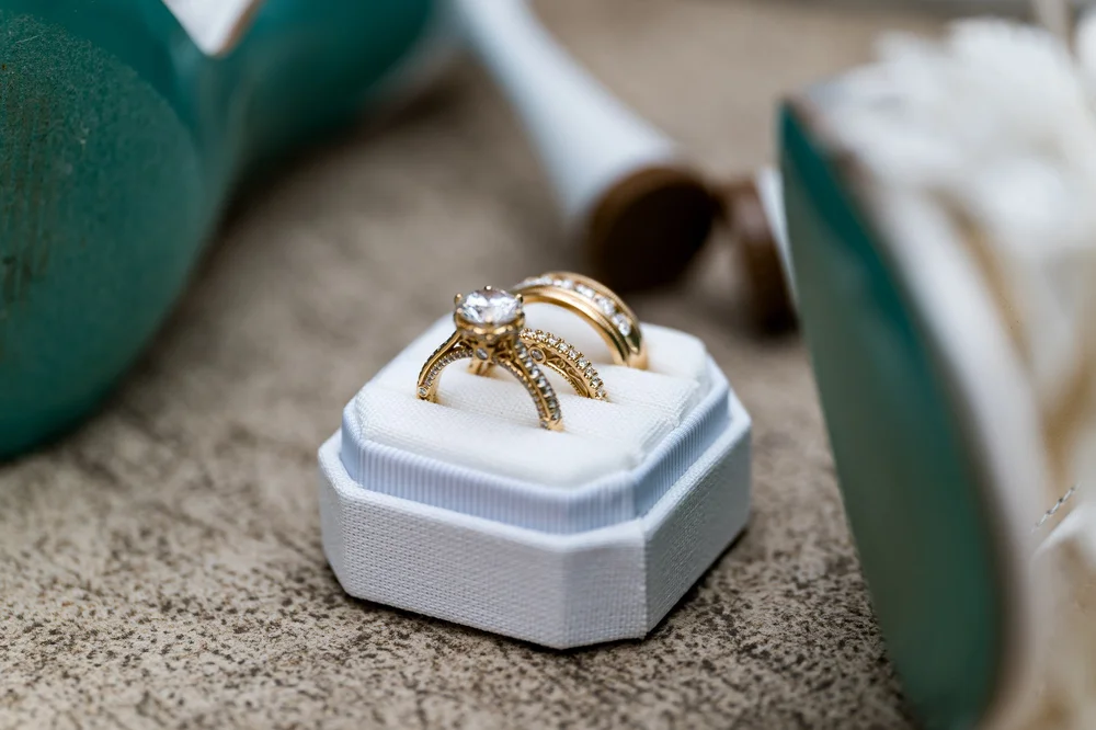 Anthony's Ocean View wedding photographer, New Haven, CT — diamond engagement ring and gold wedding bands in a velvet ring box