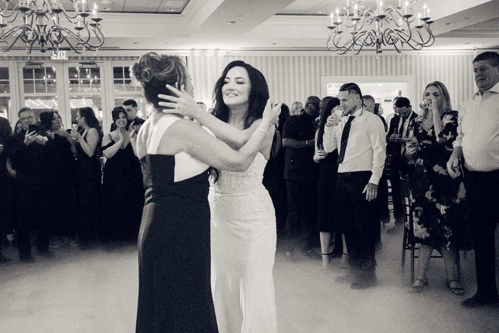 Beauport Hotel wedding videographer, Gloucester, MA — black-and-white dance floor moment between the bride and a guest