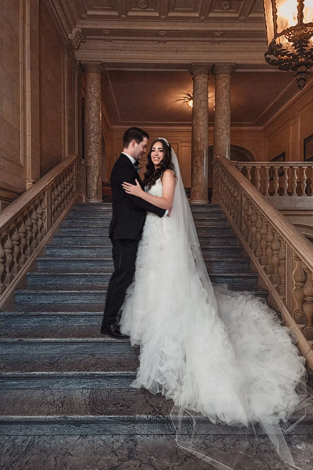 Aldrich Mansion wedding photographer, Warwick, RI — bride and groom portrait on the grand marble staircase inside the foyer