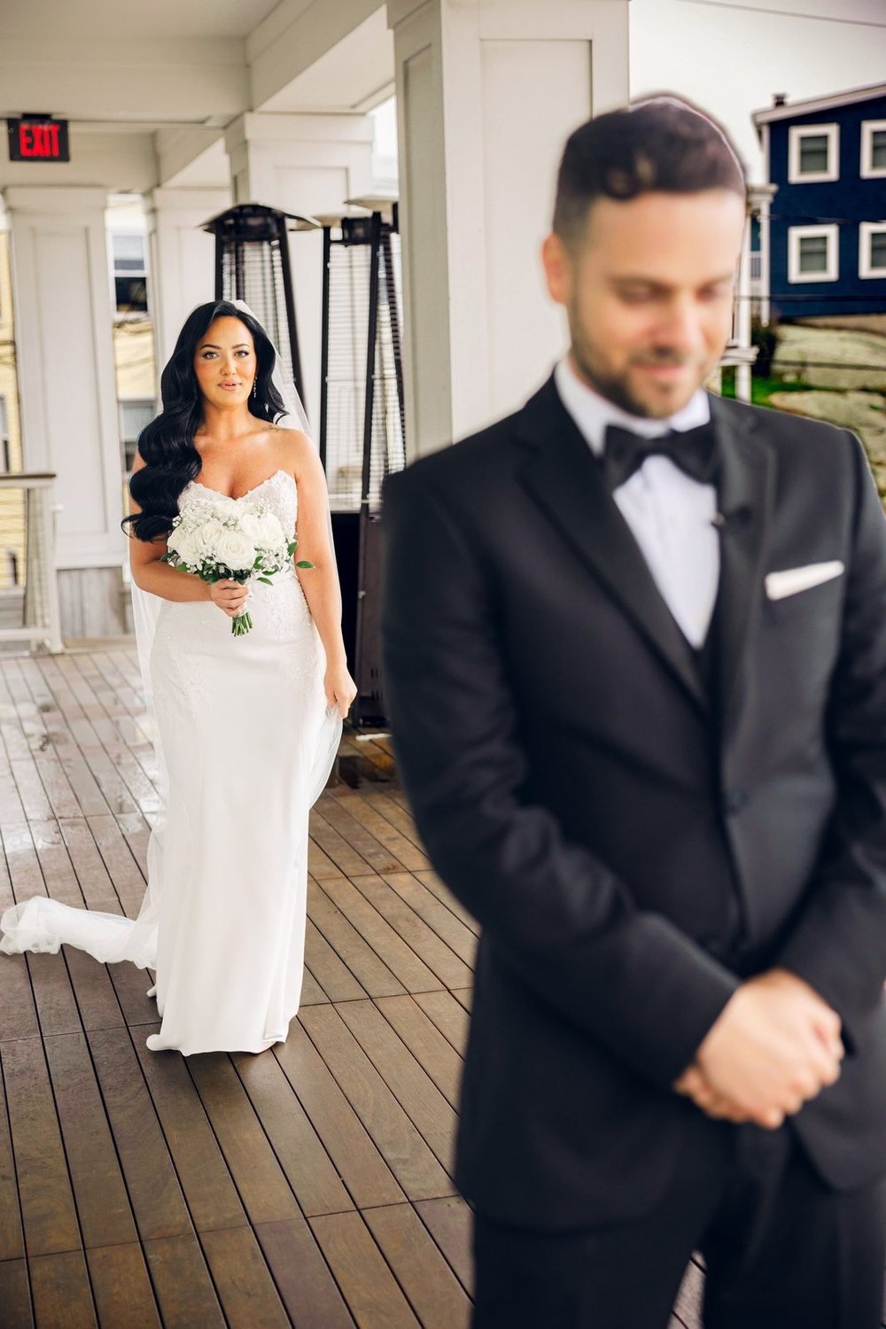 Beauport Hotel wedding photographer, Gloucester, MA — groom waiting with eyes closed as the bride approaches for their first look