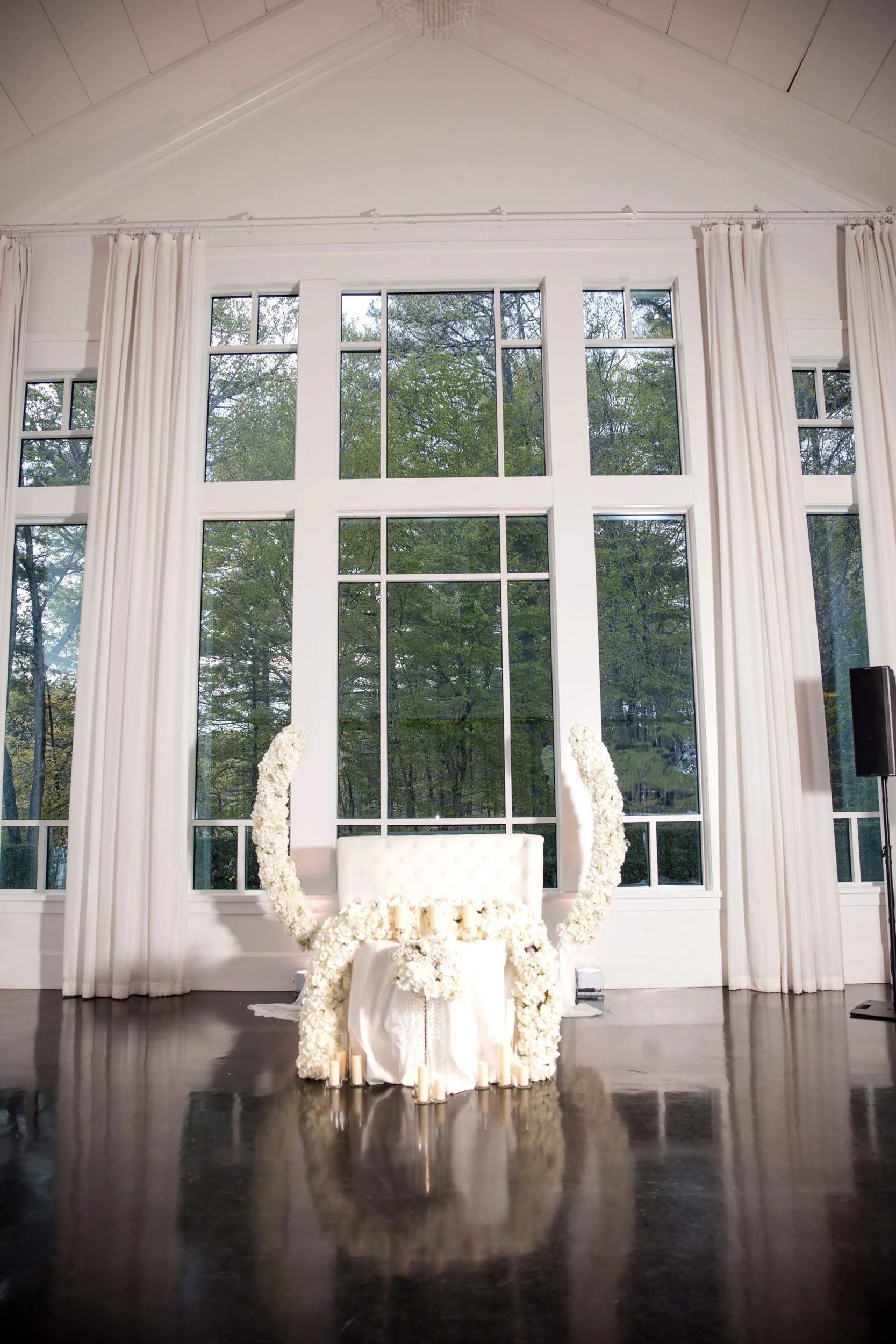 Sweetheart table before floor-to-ceiling windows in a Lakeview Pavilion ballroom, Foxborough, Massachusetts