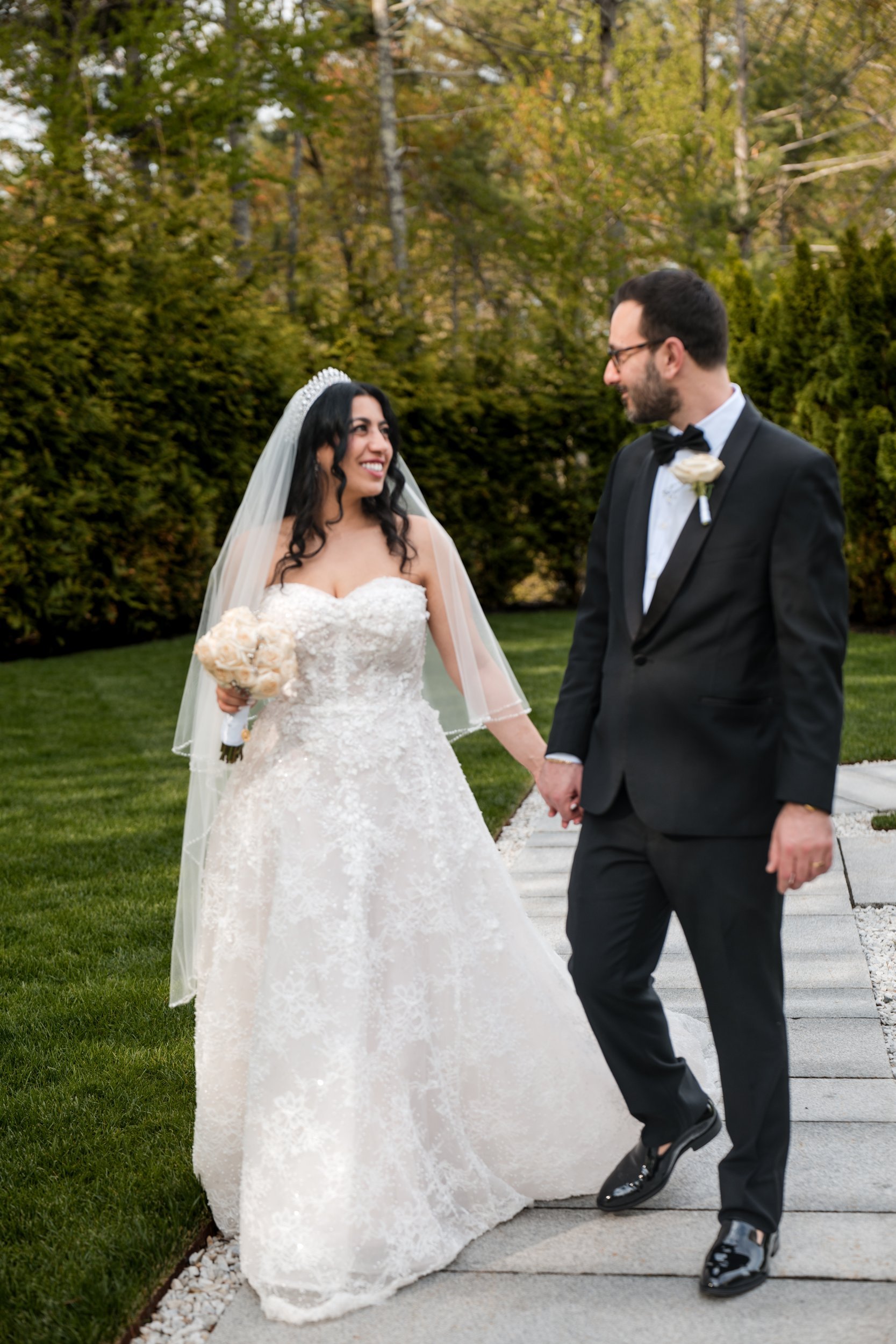 Couple walking the garden path at Lakeview Pavilion, Foxborough, Massachusetts
