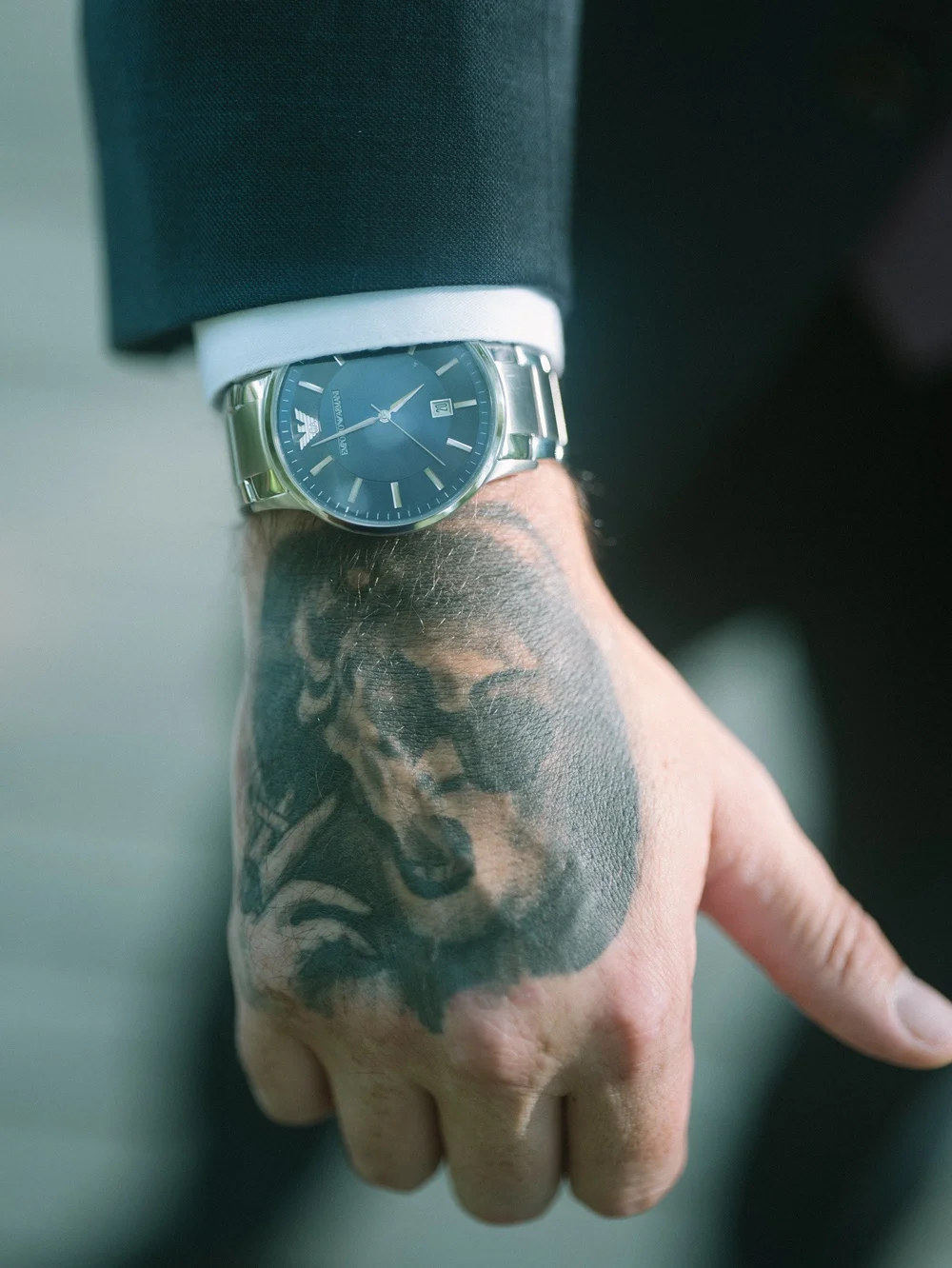 Close-up detail of the groom's watch and suit cuff before the ceremony at New England Botanic Garden at Tower Hill in Boylston, MA