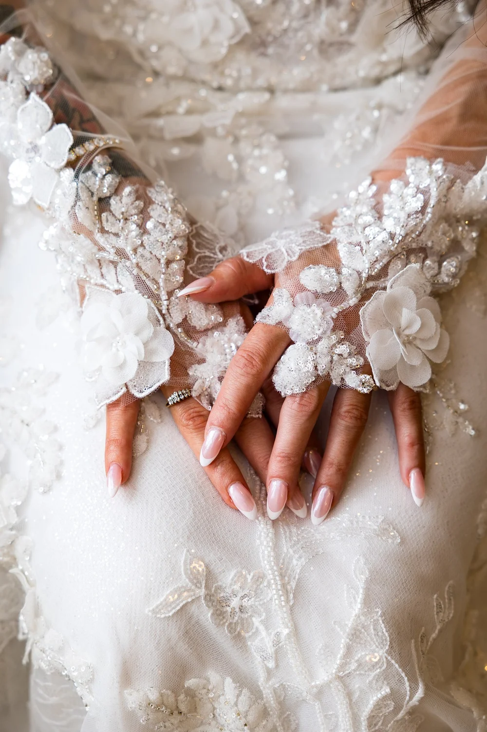 Anthony's Ocean View wedding photographer, New Haven, CT — close-up of beaded floral lace bridal gloves and diamond wedding band