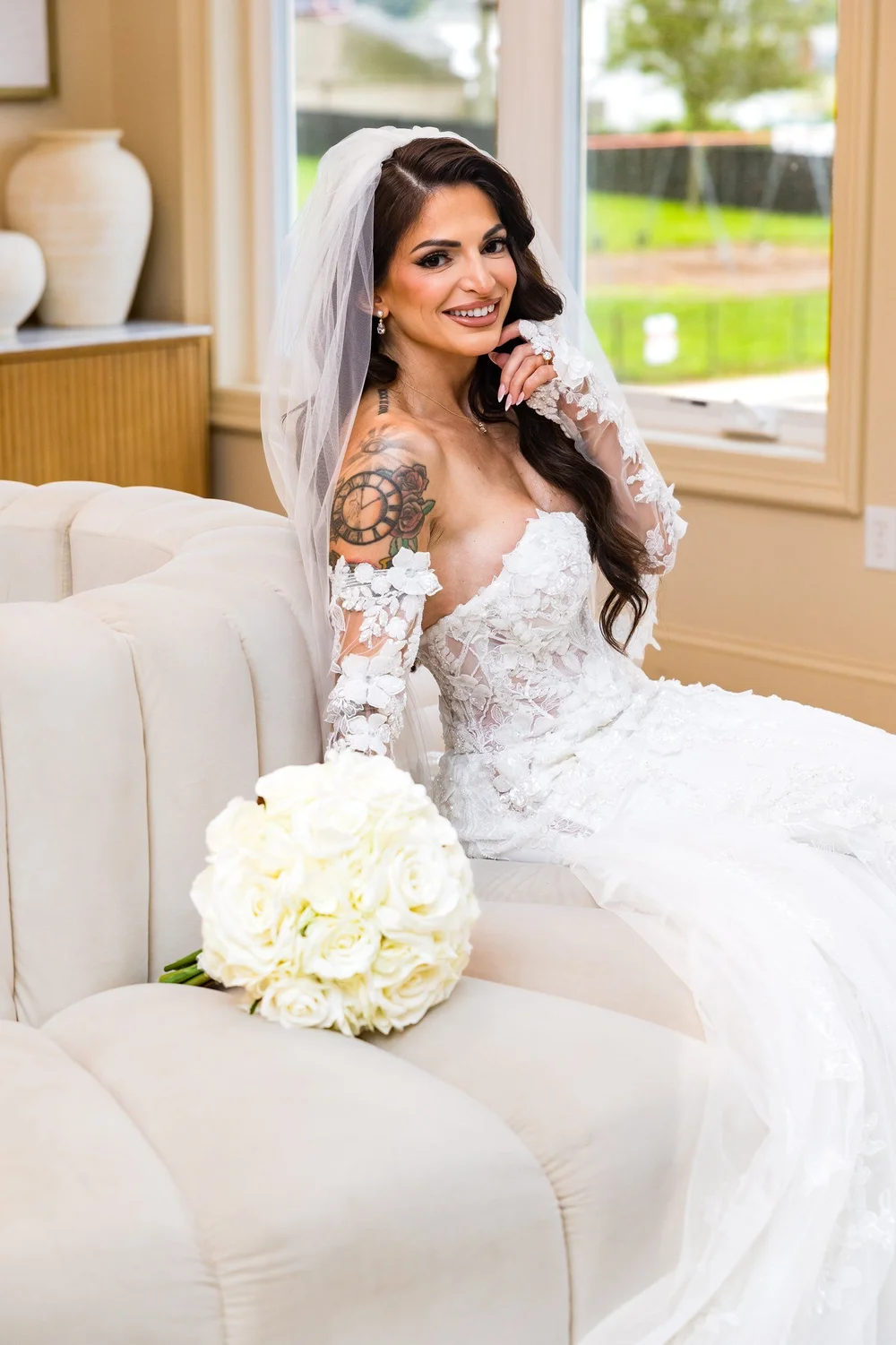 Anthony's Ocean View wedding photographer, New Haven, CT — smiling bride in floral lace sleeves in the bridal suite