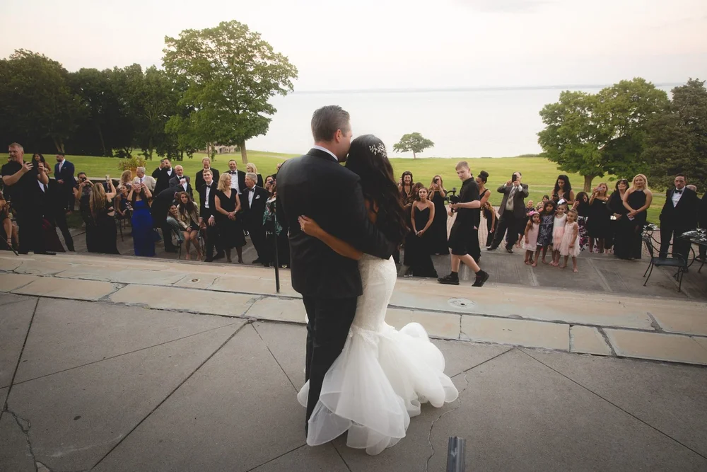 Aldrich Mansion wedding photographer, Warwick, RI — first dance on the oceanfront stone terrace overlooking Narragansett Bay