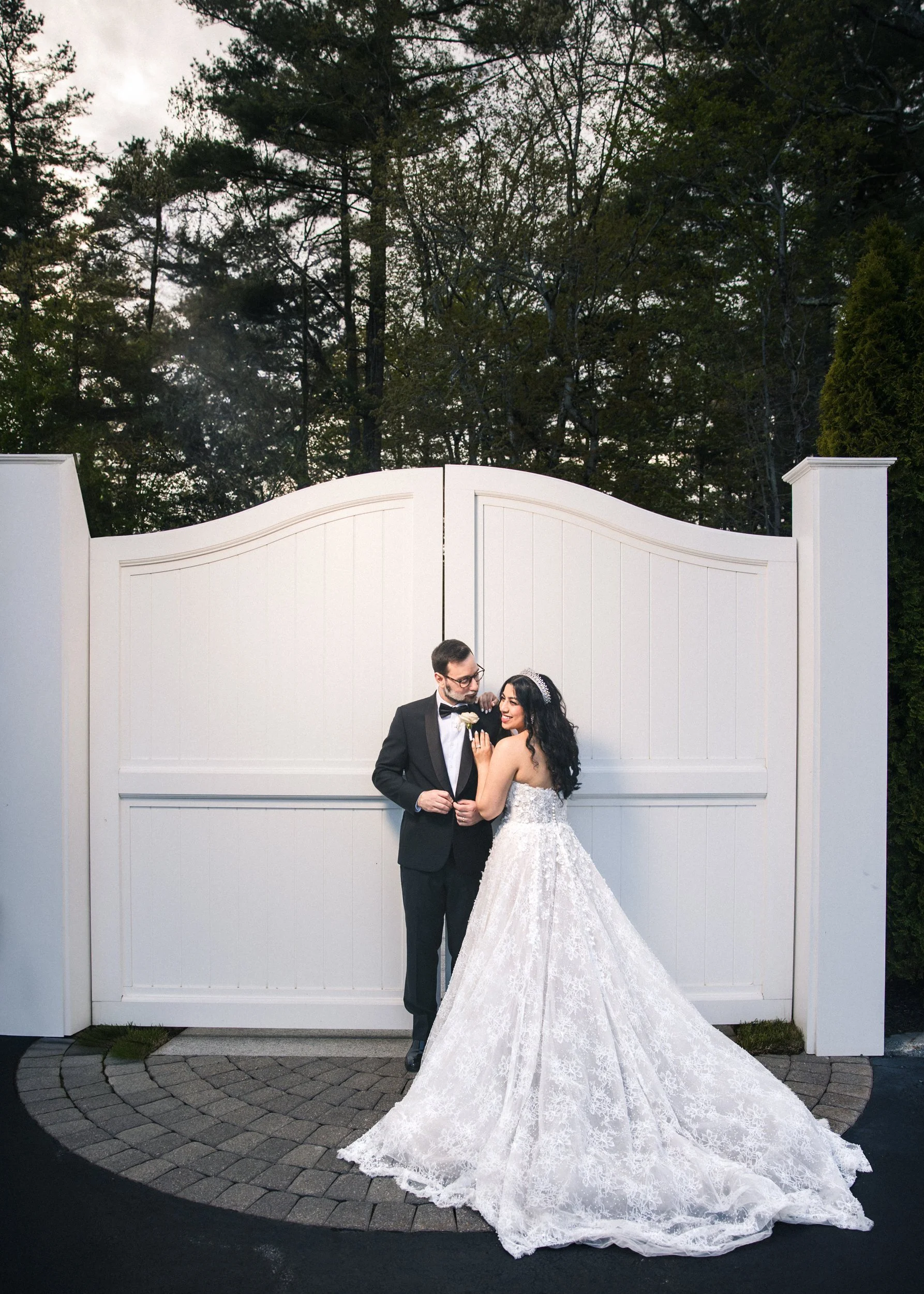 Couple at a white garden gate at Lakeview Pavilion, Foxborough, Massachusetts