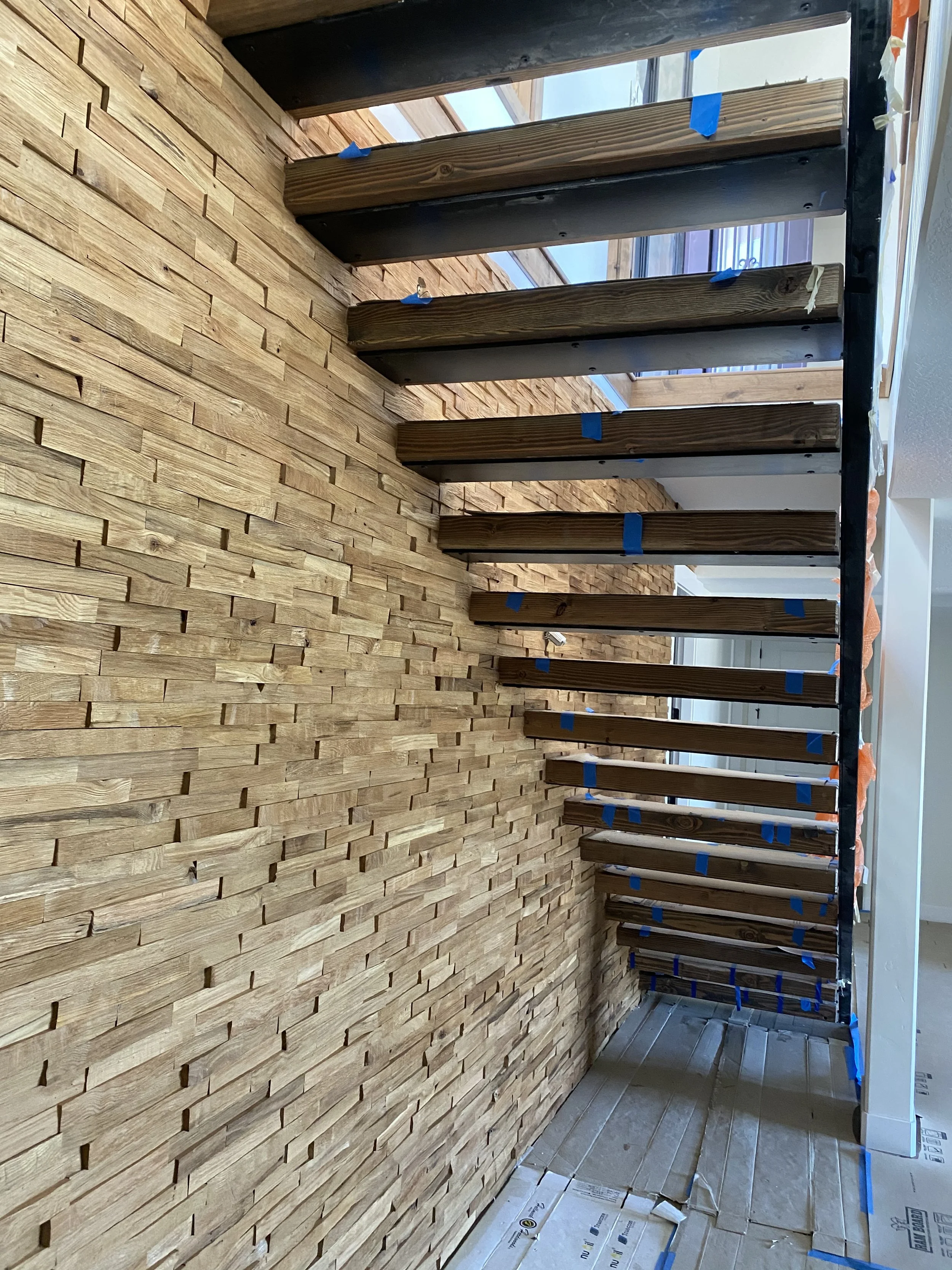 Close-up of floating staircase wood treads and steel structure