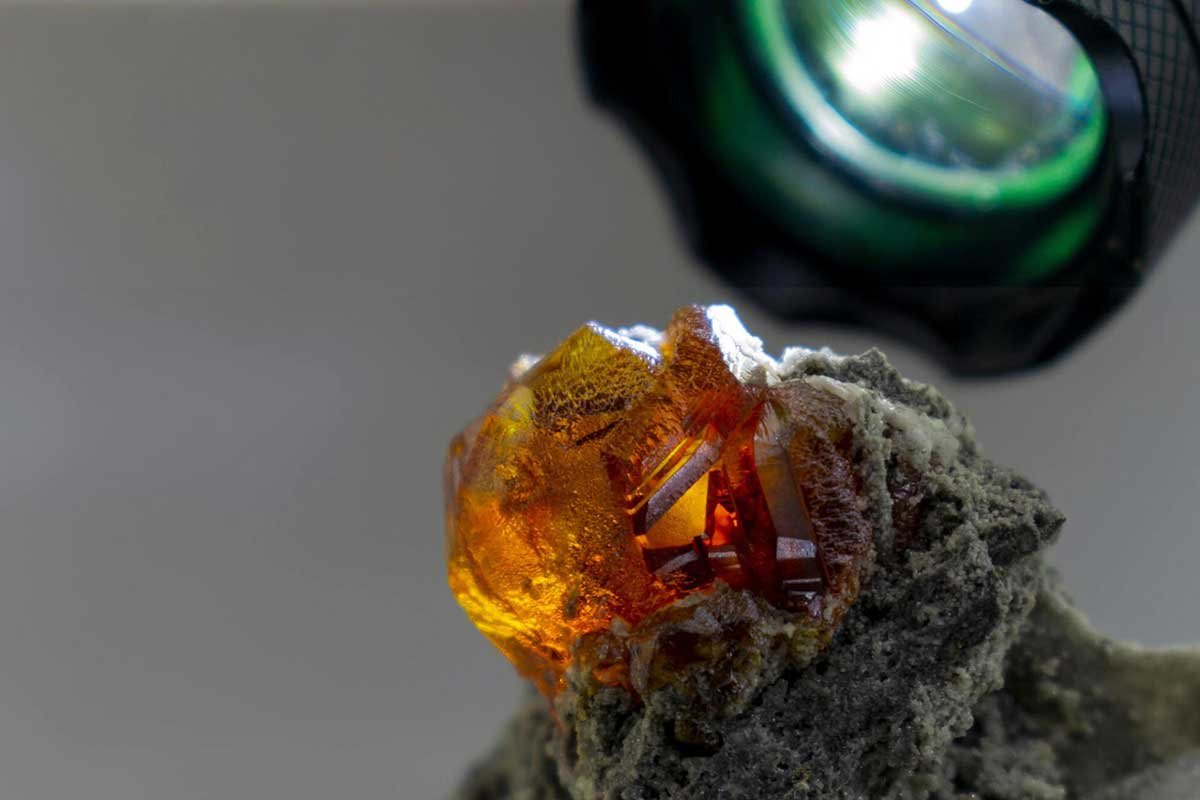 Inspecting Gem Orange Sphalerite