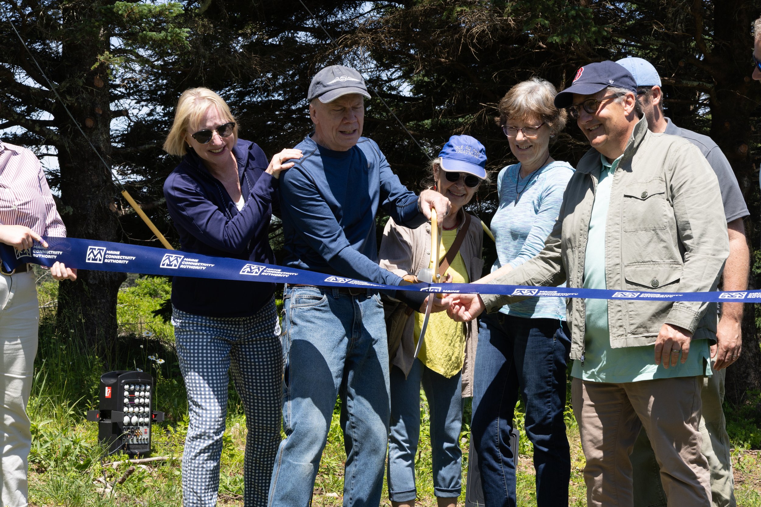 Residents gathered for the Isle au Haut fiber network ribbon-cutting, summer 2025
