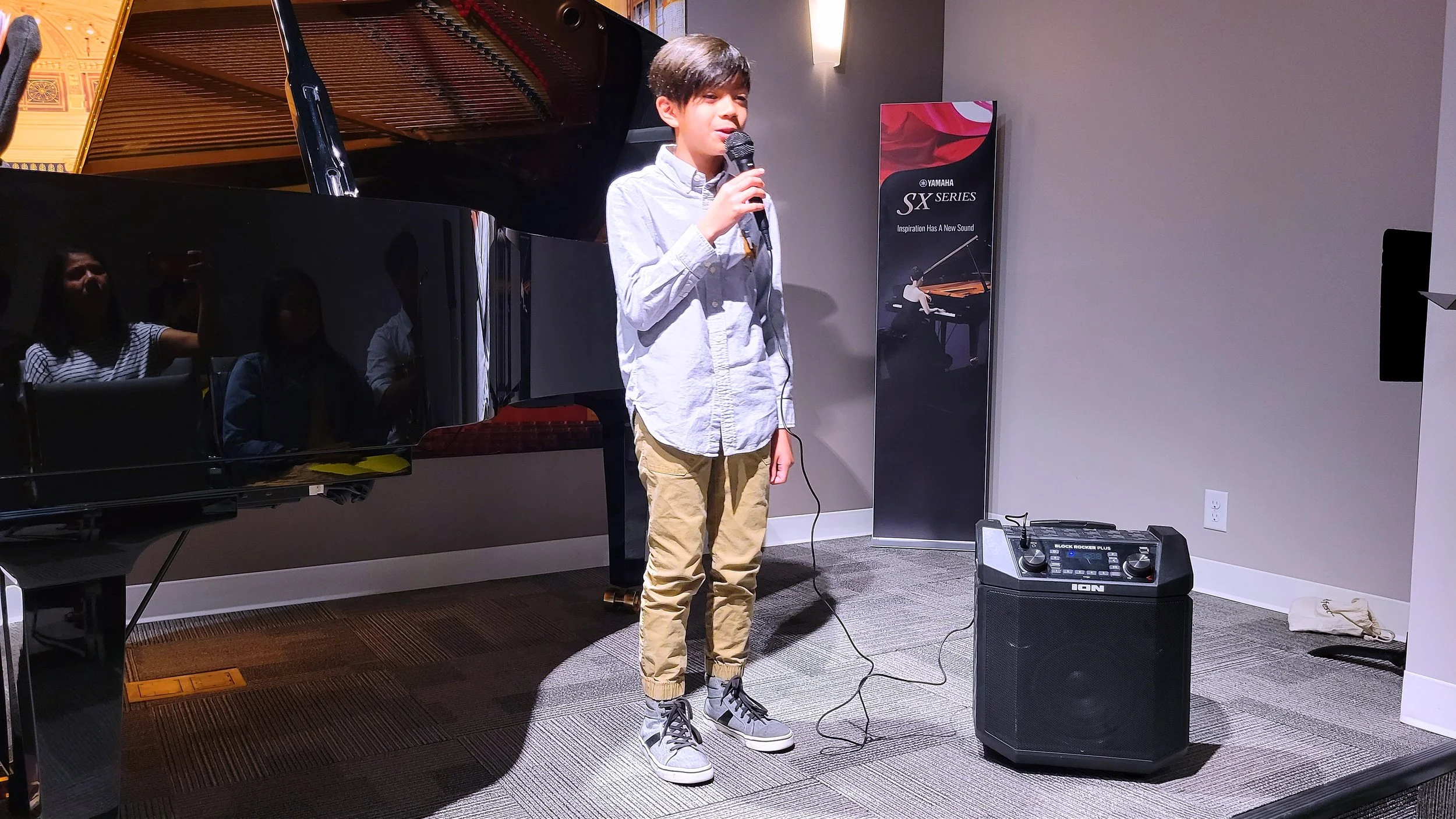 A Heart Beats student singing at a recital