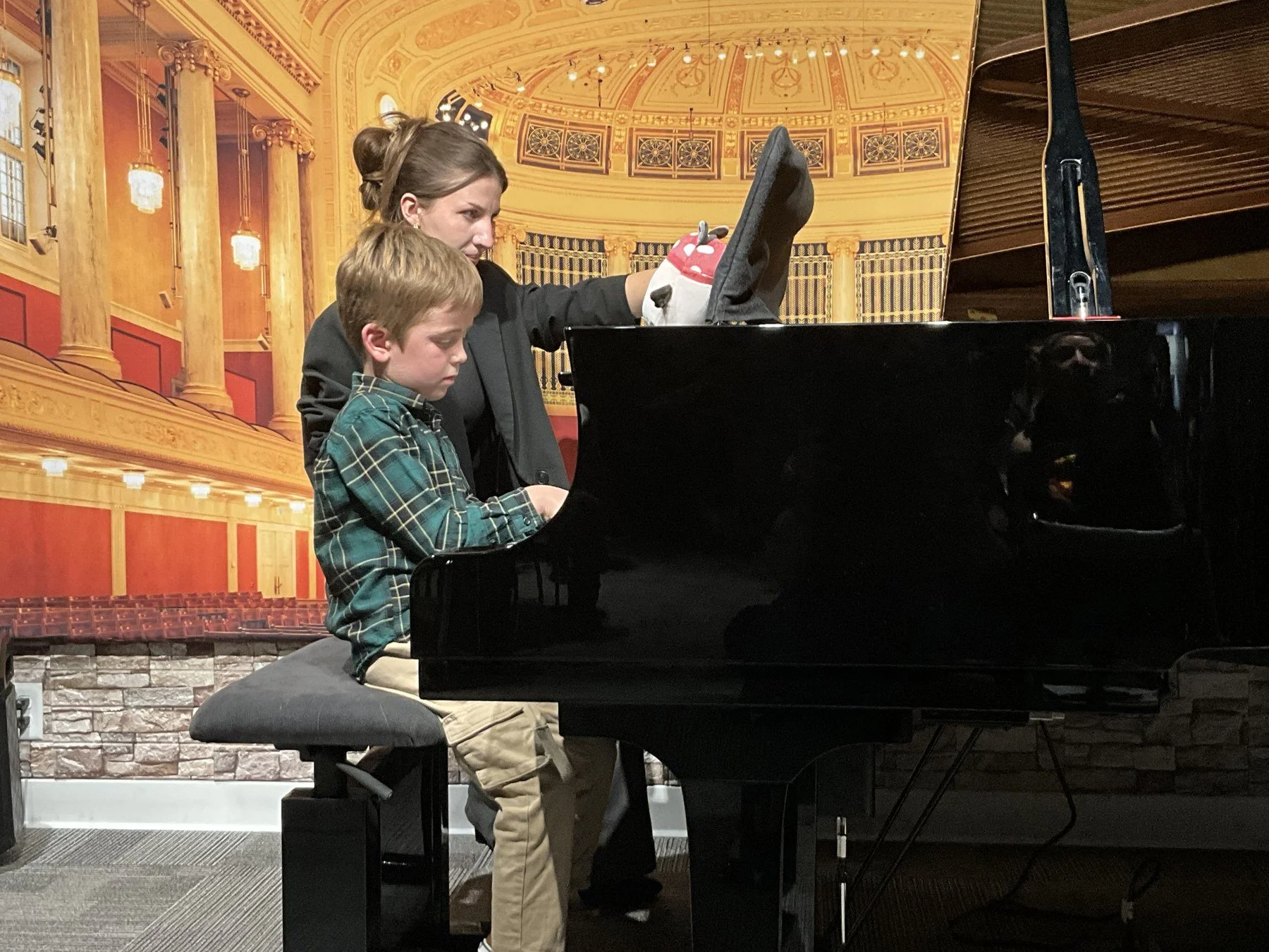 A young Heart Beats pianist performing alongside his teacher