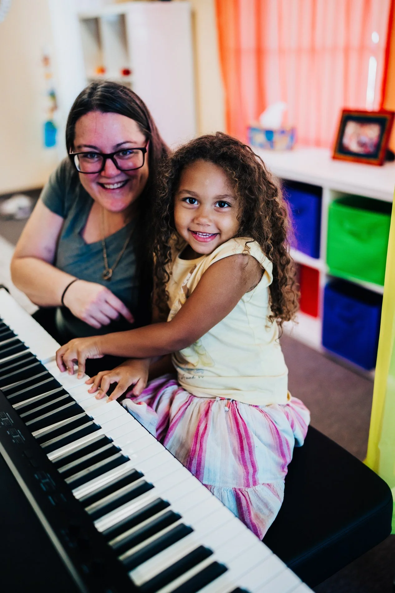 A Heart Beats student and grown-up together at a keyboard