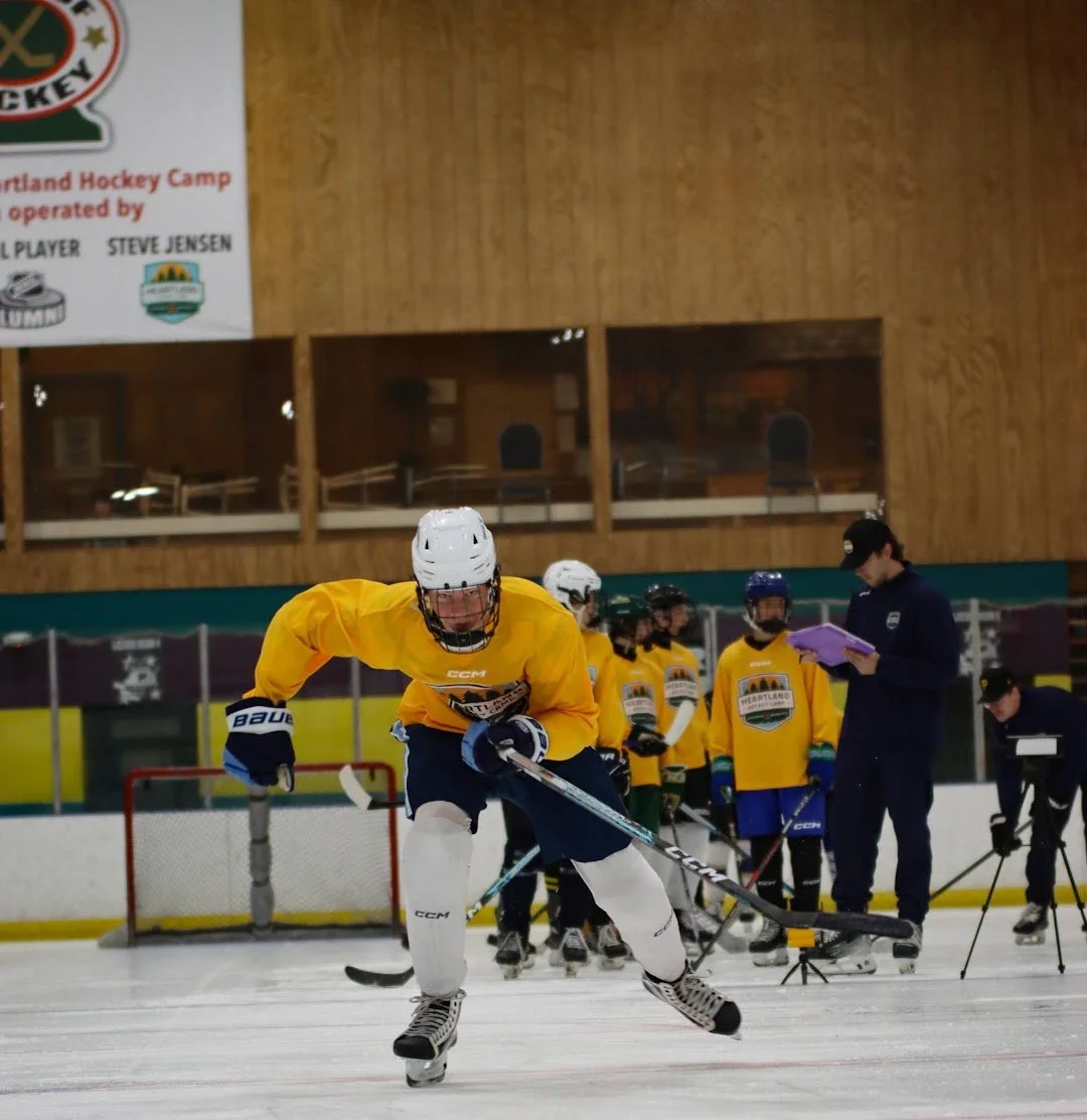 Heartland Hockey Camp player training on the ice