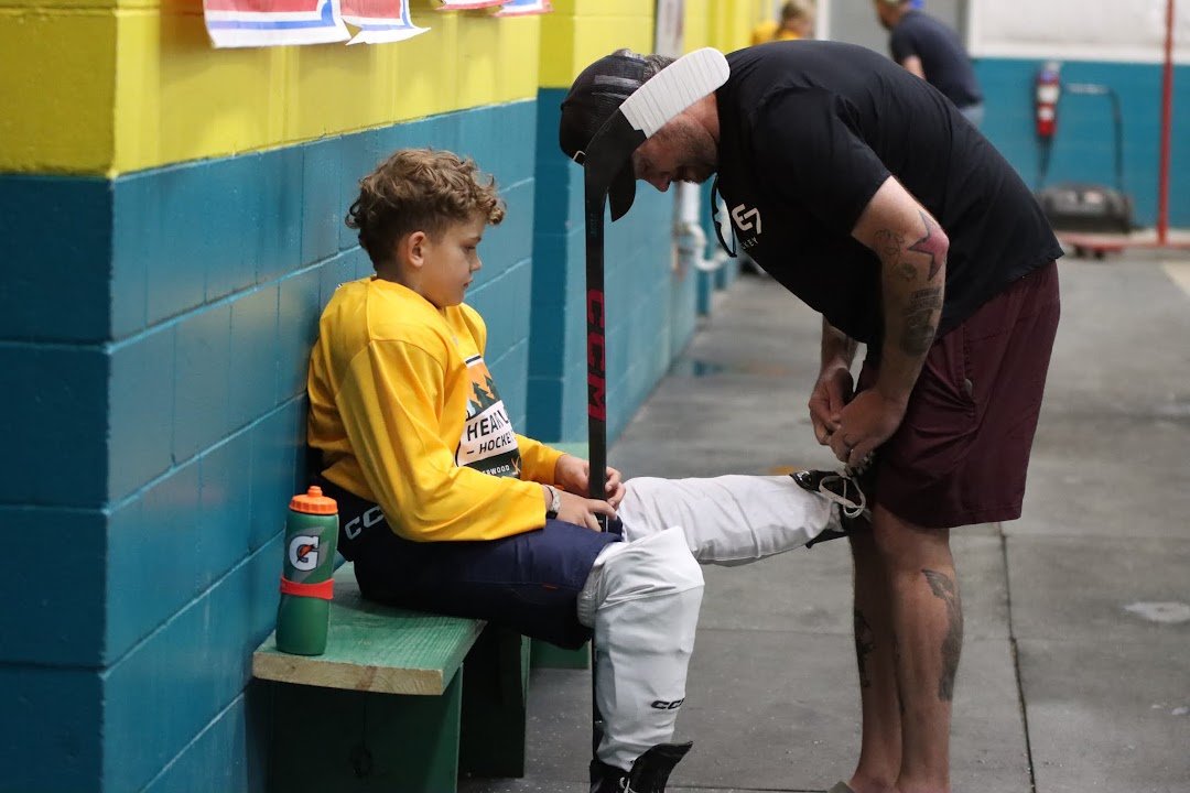 Father and son at Heartland Hockey Camp
