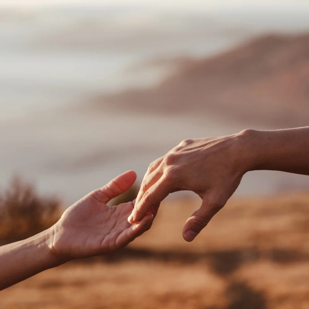 Hands reaching out to touch