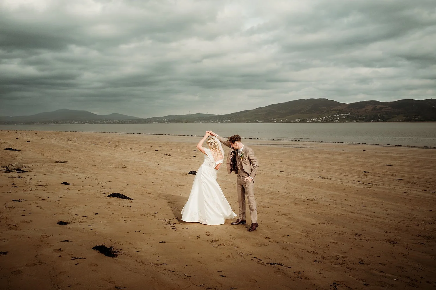Glen twirling Jayne on the beach at Lough Swilly near Rathmullan House