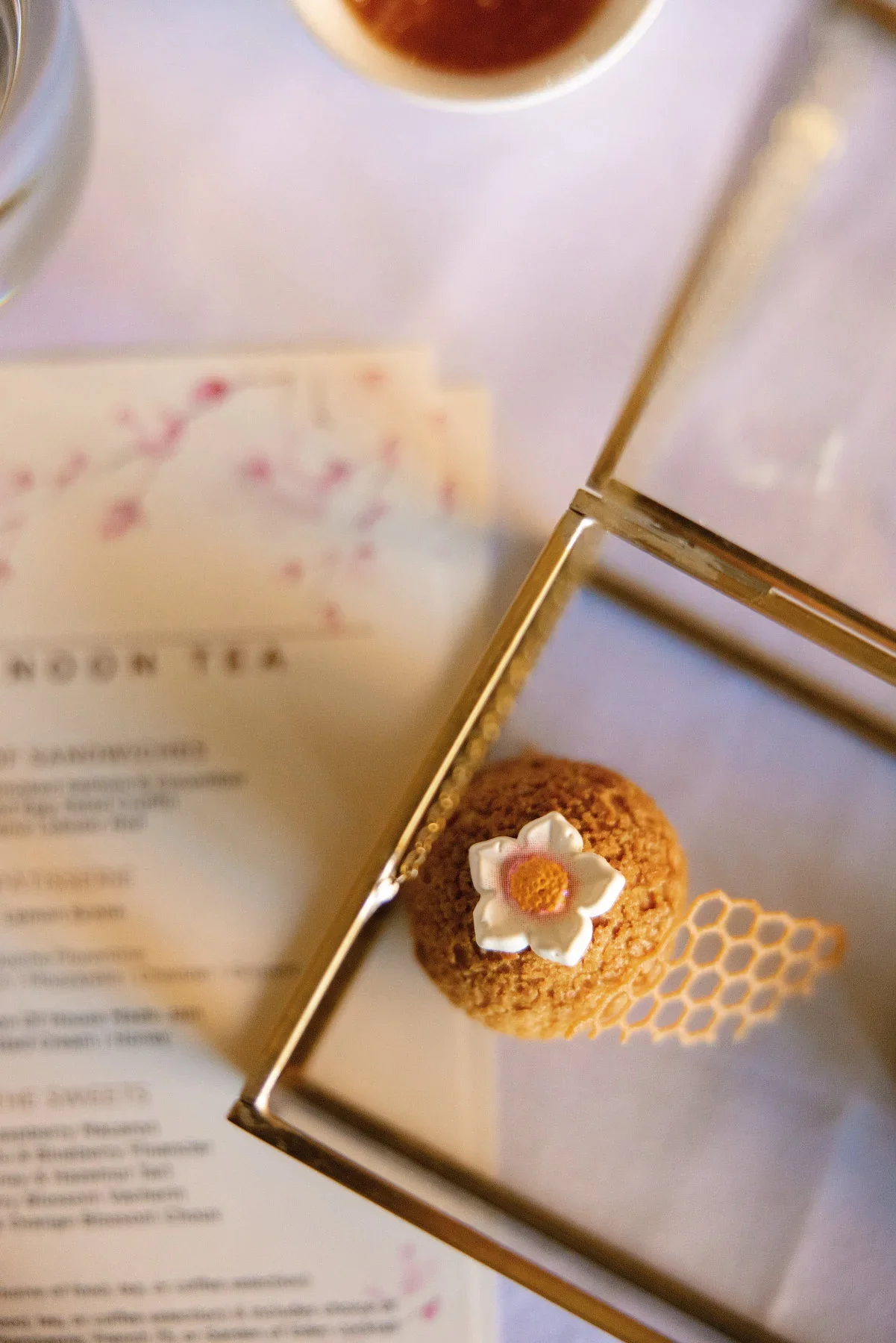 Afternoon tea menu and pastry detail at a luxury Washington DC hotel, editorial food photography