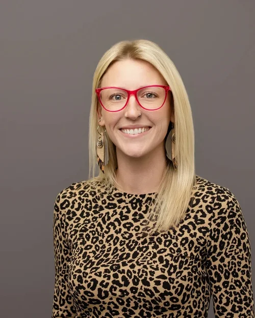 Event headshot booth result: attendee in red glasses on a grey backdrop