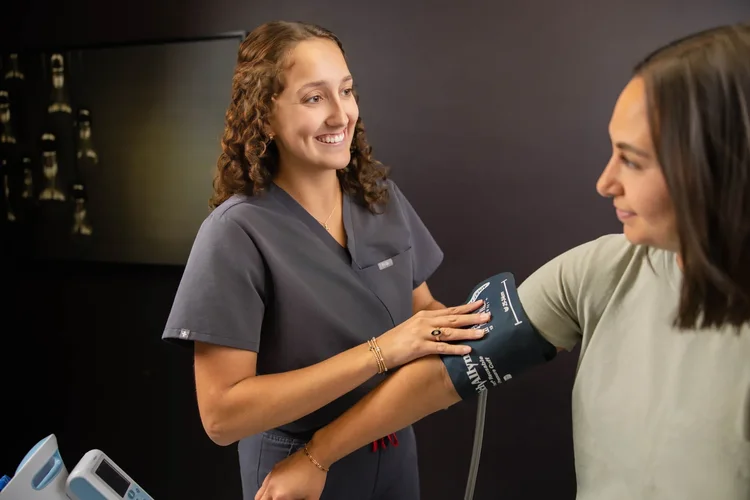 Clinical trial participant blood pressure check by Jack Robert Photo