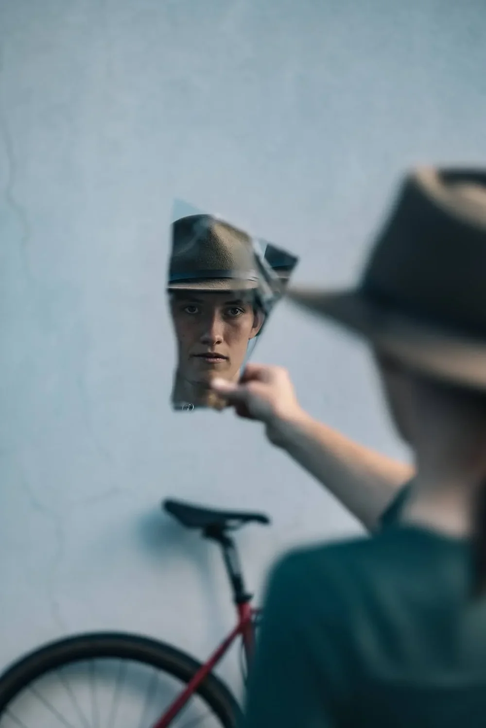 Shattered-mirror reflection portrait of cyclocross athlete Hannah Arensman with bike, Morganton NC by Jack Robert