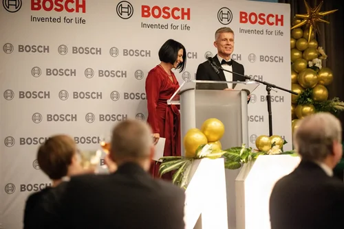 Corporate keynote speaker at a podium during a Greenville, SC event