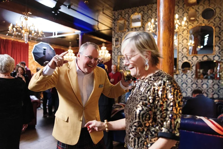 Gala candid of a toast and laughter at a Greenville SC event by Jack Robert Photo