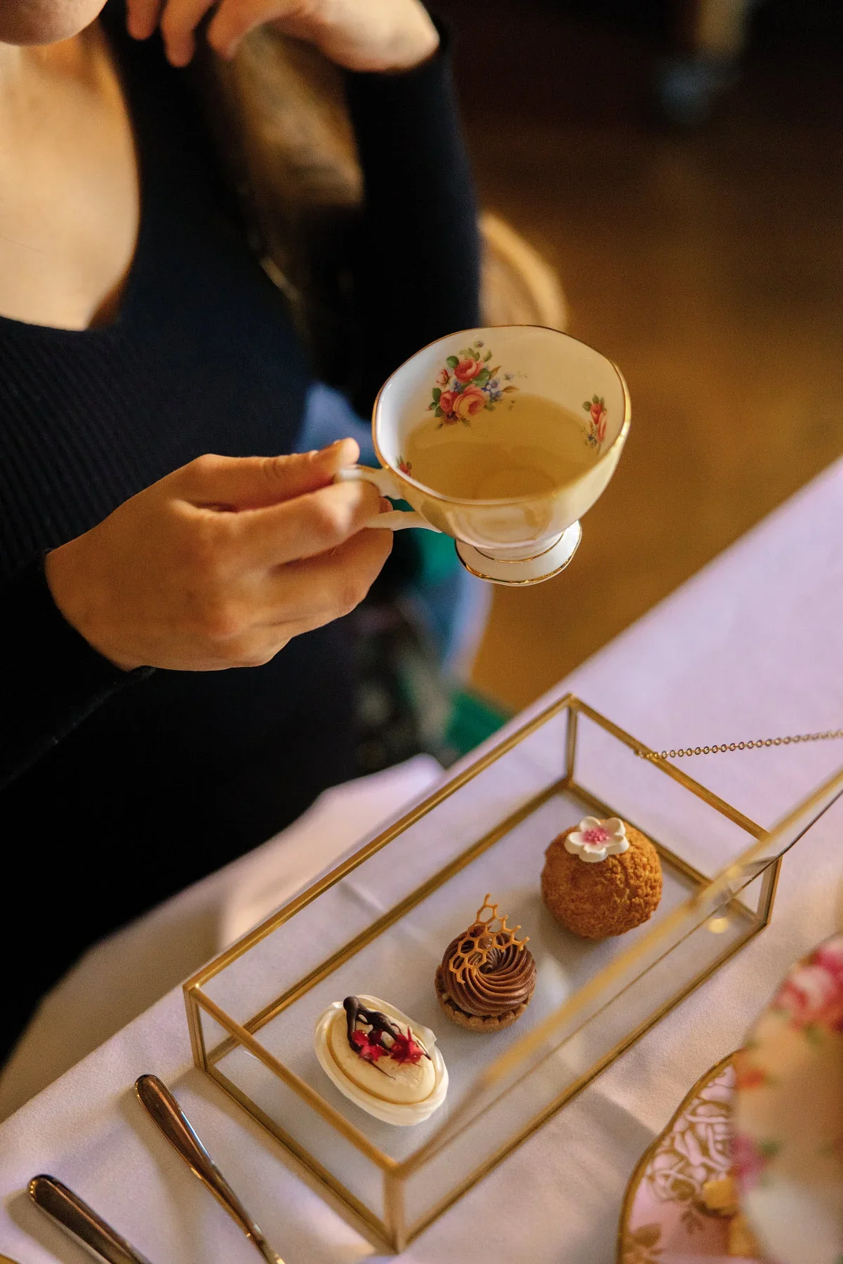 Afternoon tea pastries on a tiered tray at Rosewood Washington DC, hotel food and beverage photography