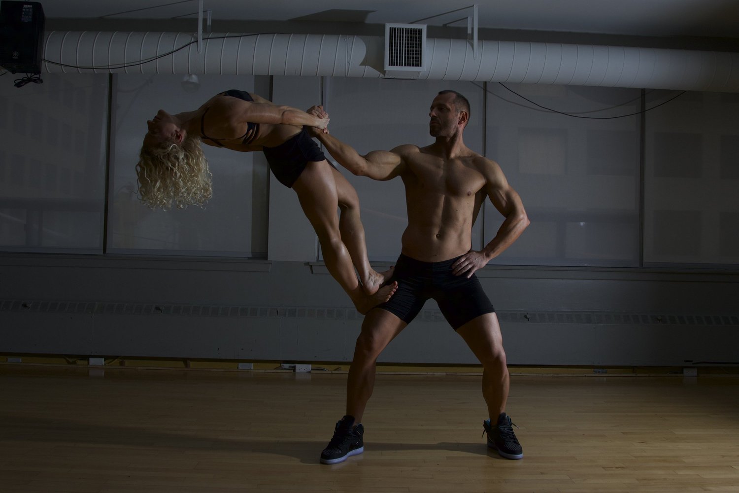 Vlad lifting Paula in a back-bend balance