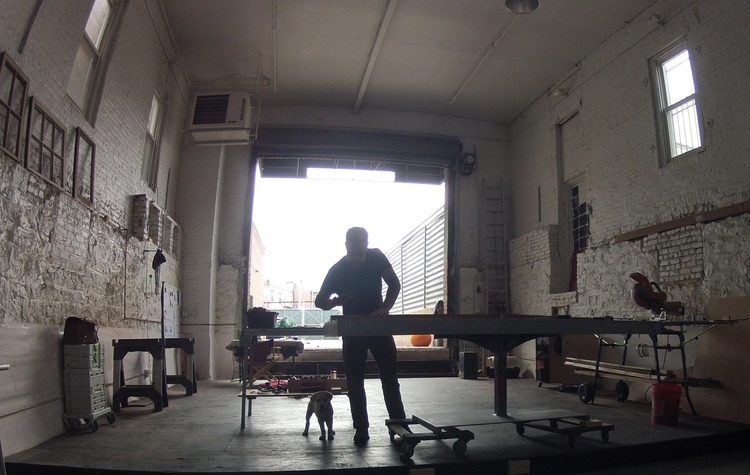 Silhouette in the open shop door