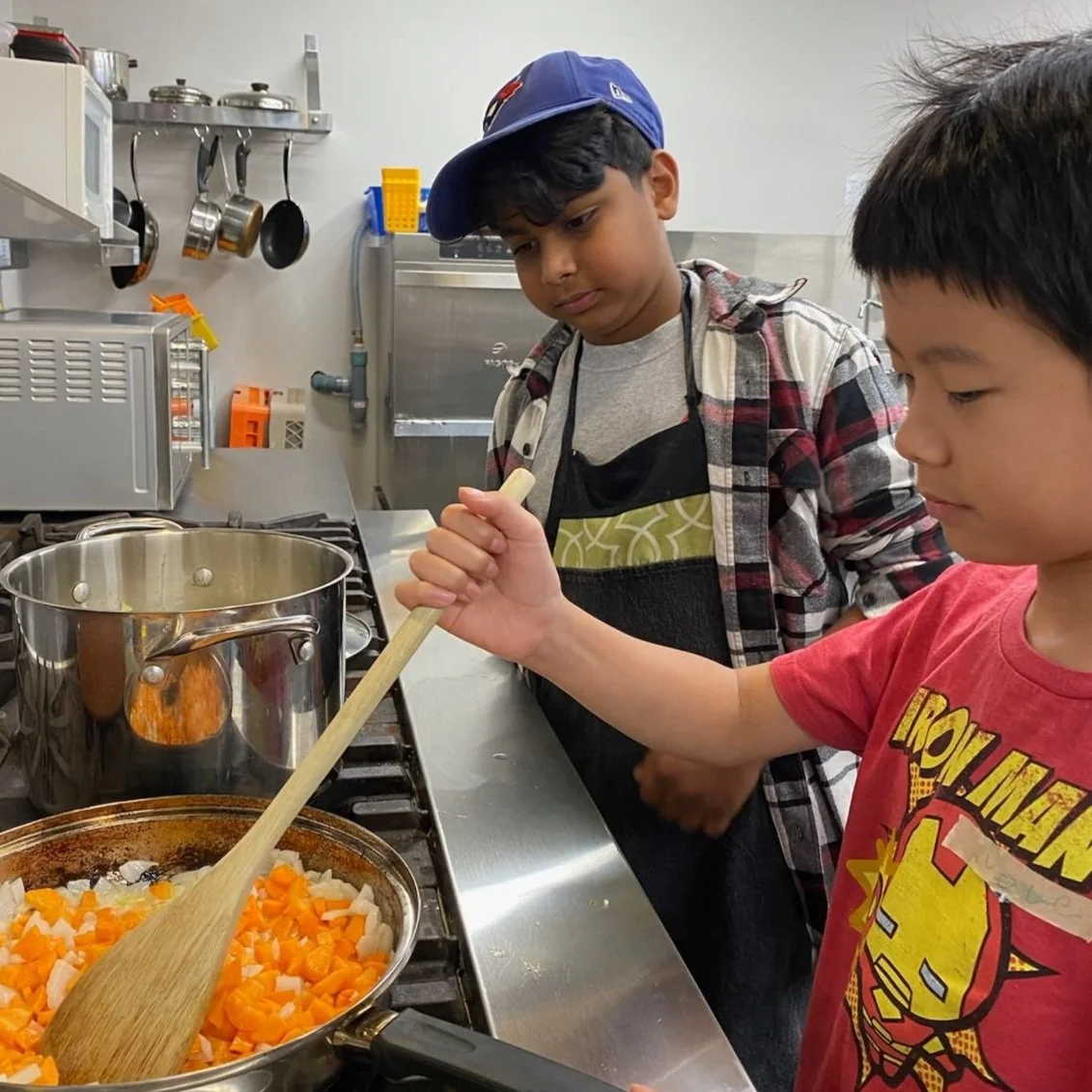 Teen cooking safely at the stove