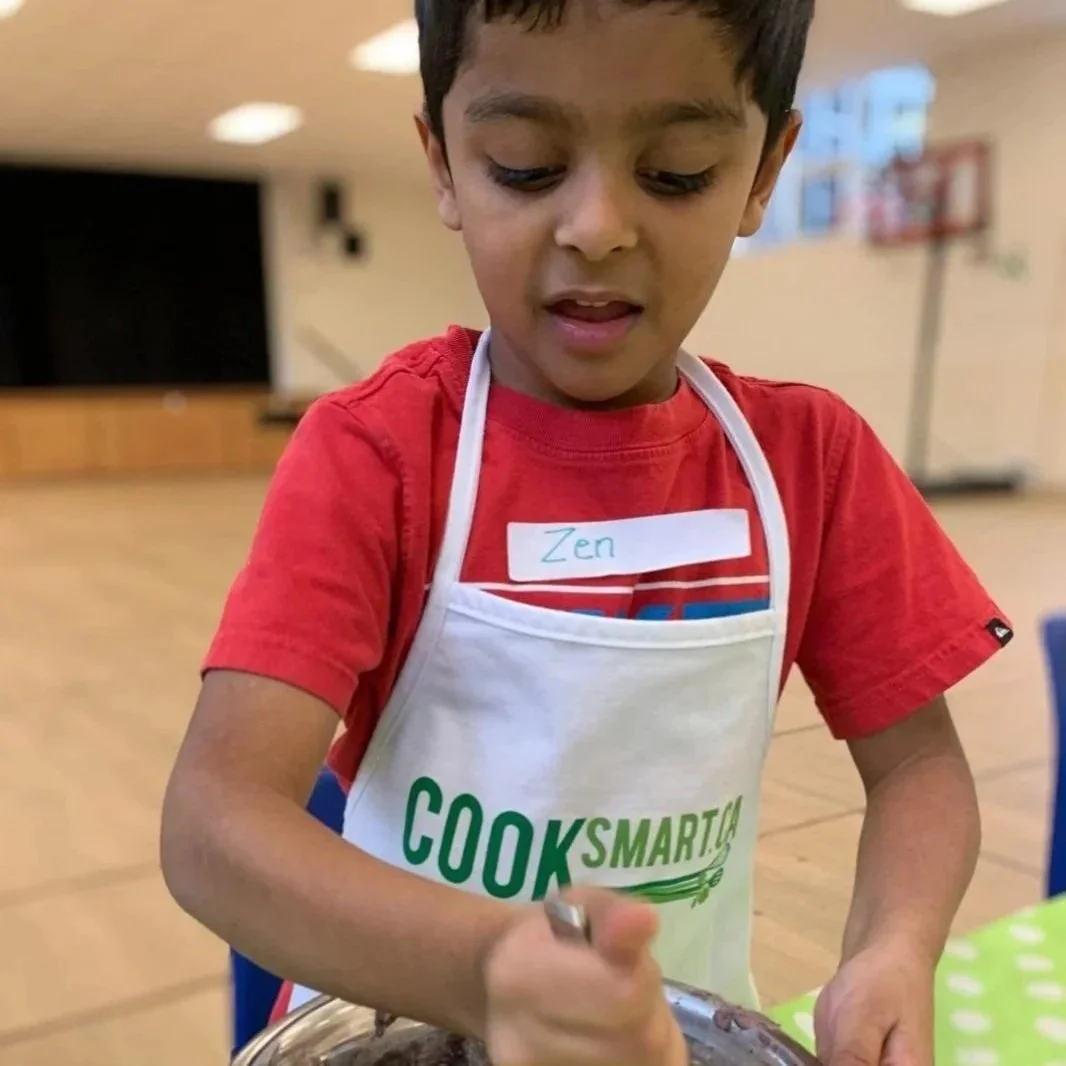 Child baking at camp